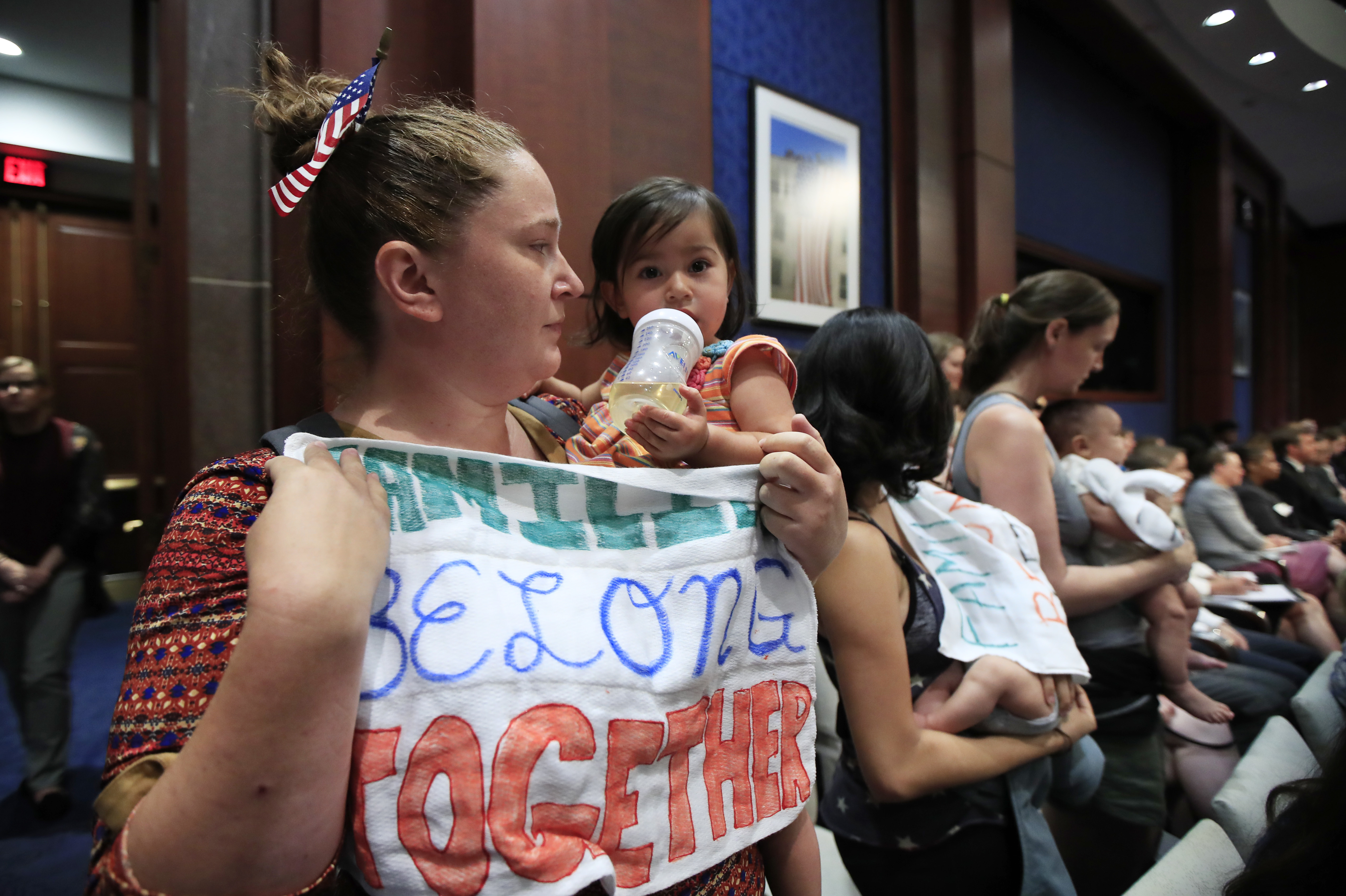Lucy Martin and her daughter Branwen Espinal together with other mothers and their babies, attend a House Committee on the Judiciary and House Committee on Oversight and Government Reform hearing, to express their support and sympathy to immigrants and their families and objection to the forced separation of migrant children from their parents, on Capitol Hill in Washington, Tuesday, June 19, 2018. (AP Photo/Manuel Balce Ceneta)