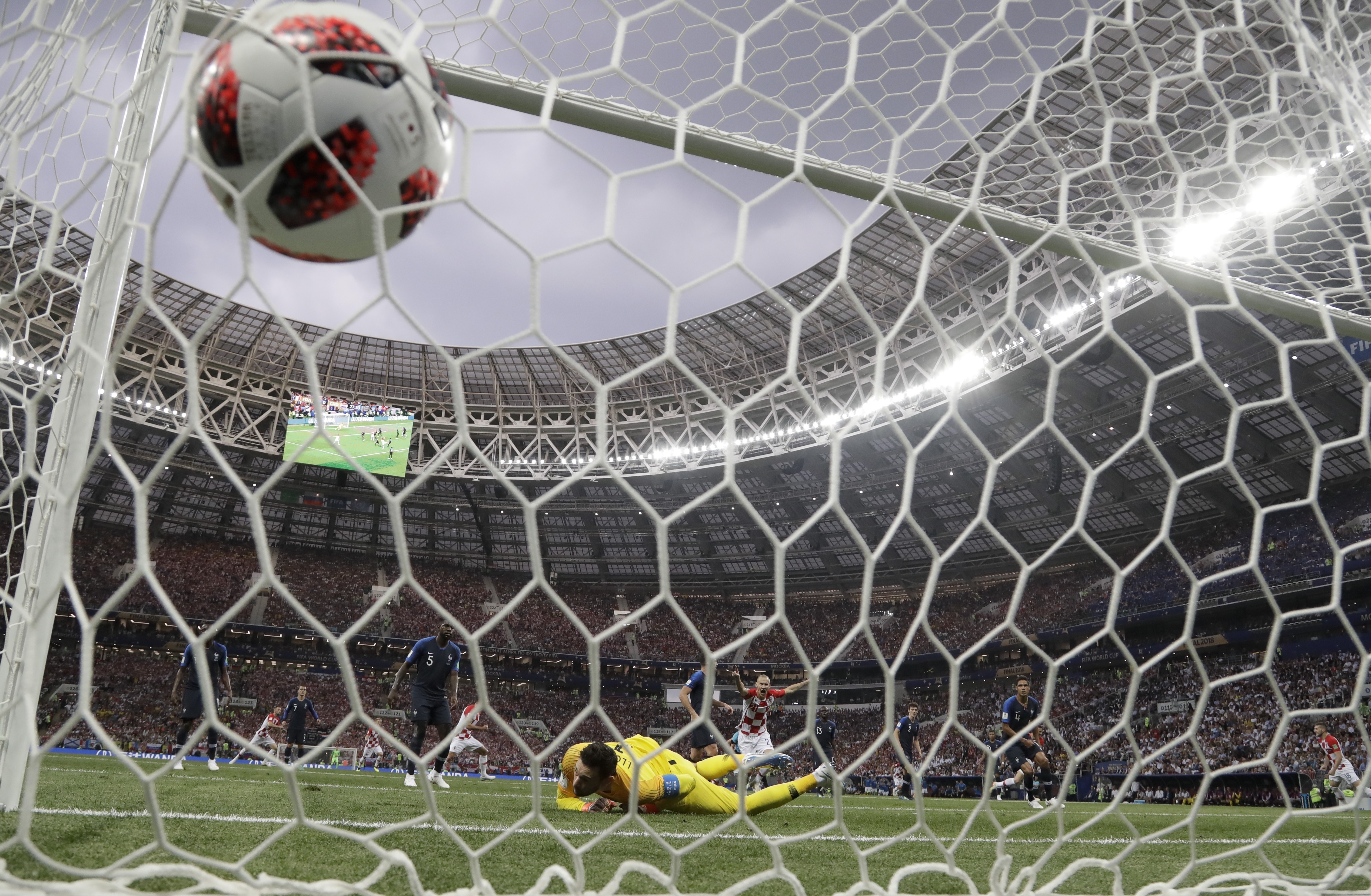 France goalkeeper Hugo Lloris looks at the ball as Croatia's Ivan Perisic scores his side's opening goal, during the final match between France and Croatia at the 2018 soccer World Cup in the Luzhniki Stadium in Moscow, Russia, Sunday, July 15, 2018. (AP Photo/Petr David Josek)