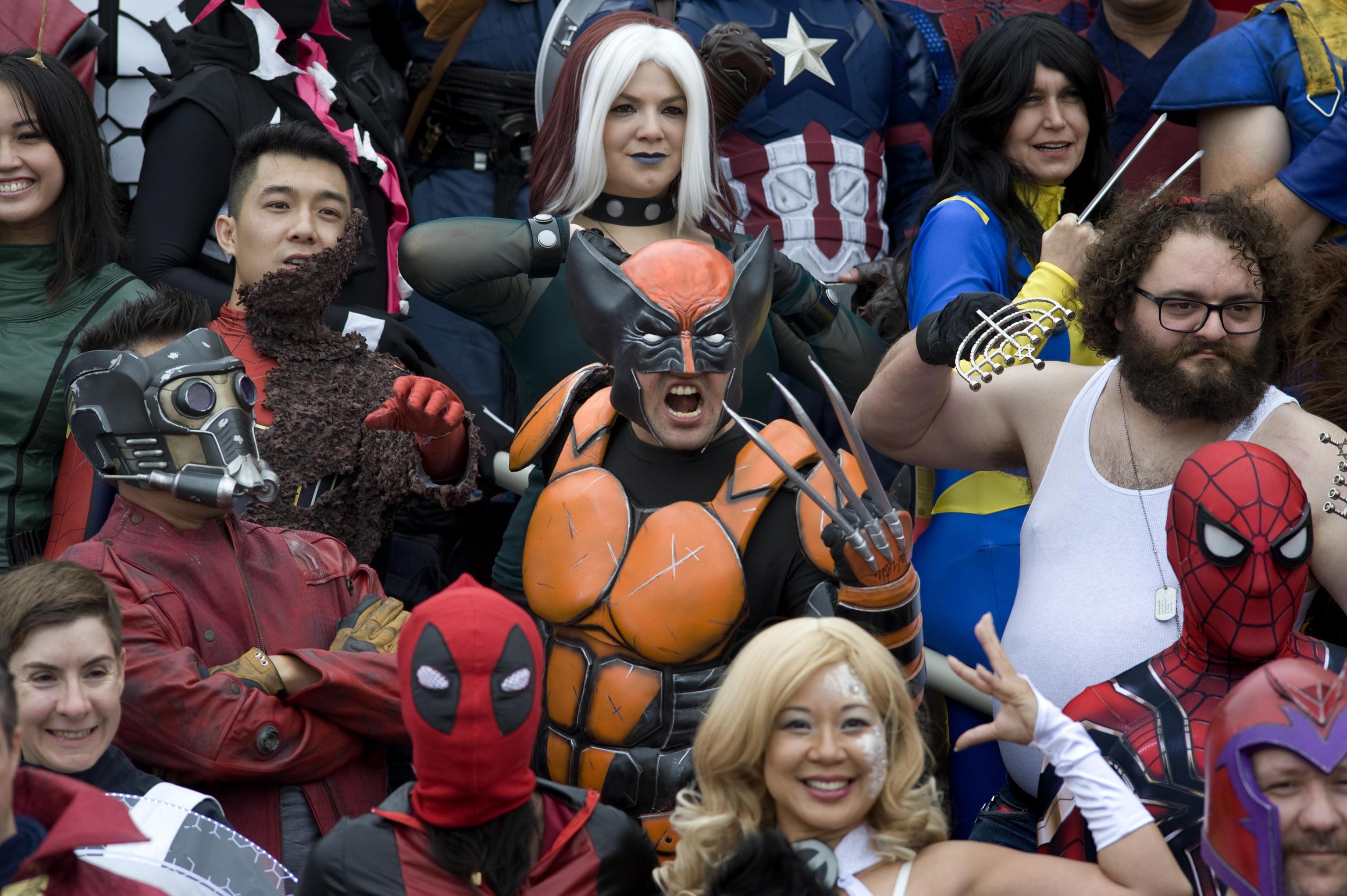 epa06901775 eople participate in a Marvel Comics photo shoot on the second day of Comic Con International in San Diego, California, USA, 20 July 2018. People dressed as Marvel Comics characters or their alterations of the characters gathered for a series of group photos.  EPA/DAVID MAUNG