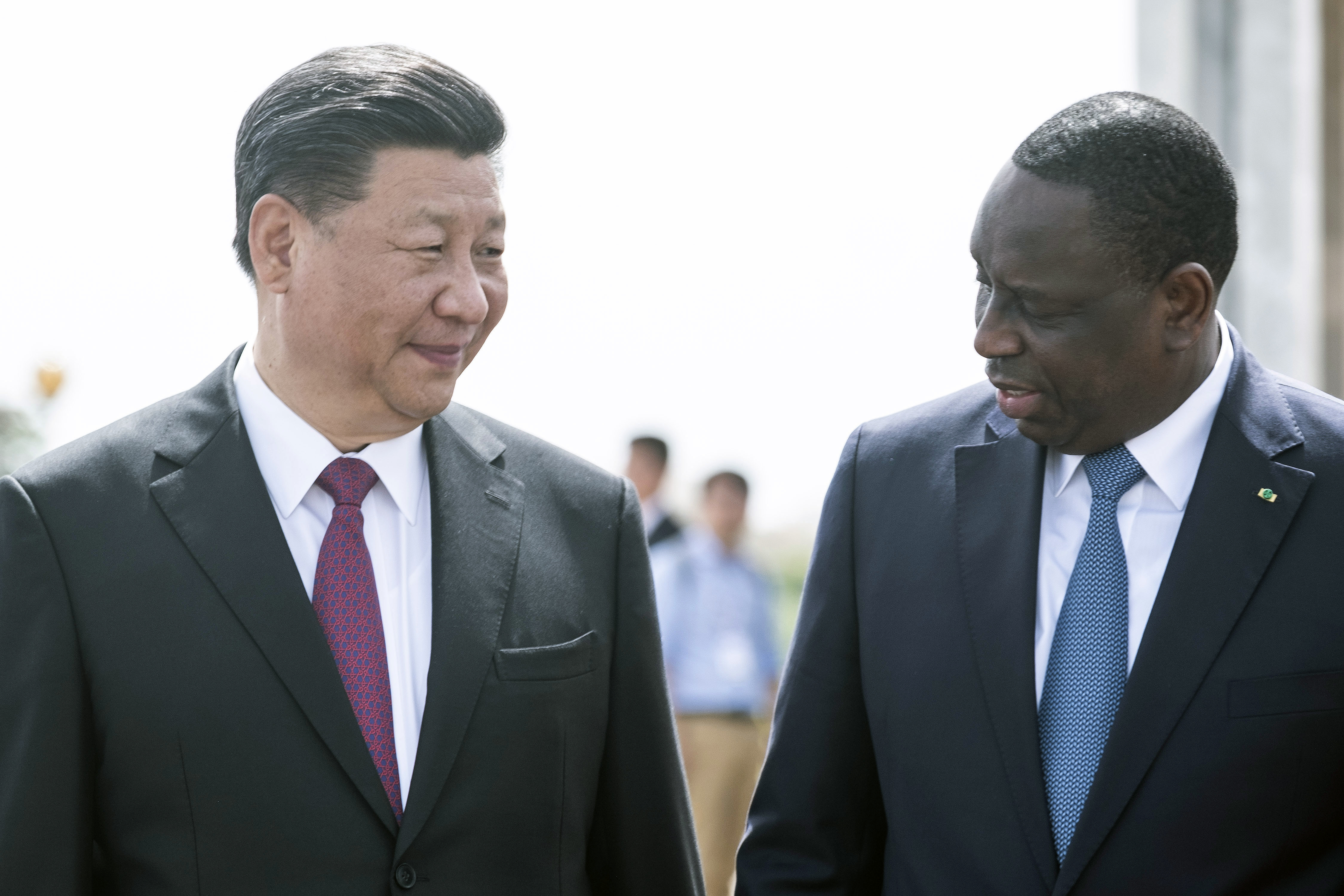 Senegal president Macky Sall, right, and Chinese President Xi Jinping, arrive at the State House in Dakar, Senegal, on the first day of a state visit Saturday, July 21, 2018. Chinese President Xi Jinping arrived in Africa on Saturday on a four-nation visit, seeking deeper military and economic ties.(AP Photo/Xaume Olleros)