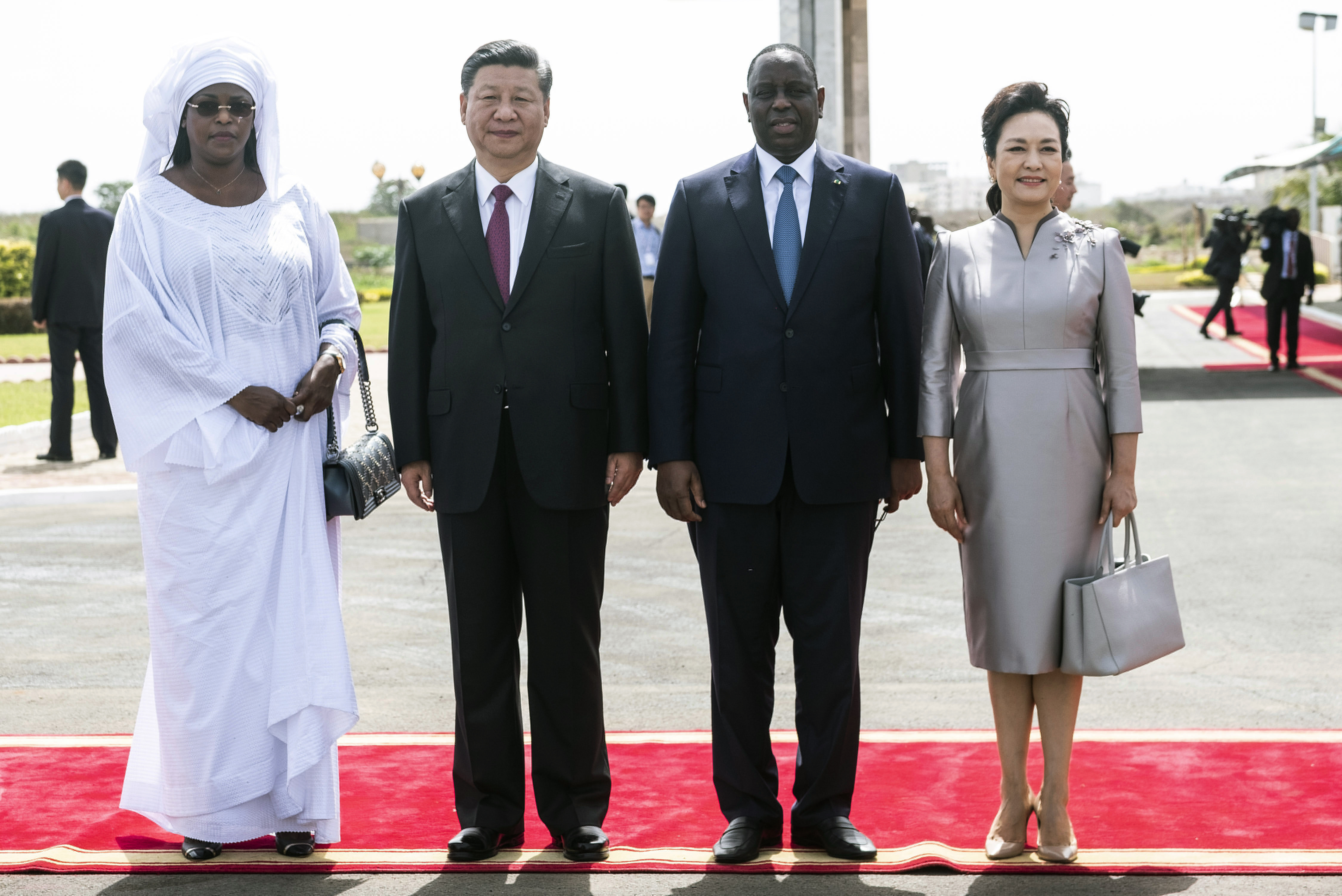 Senegal's President wife Marieme Faye Sall, left, Chinese President Xi Jinping, second, left, President of the Republic of Senegal, Macky Sall, Third left, first lady of china Peng Liyuan pose for a photograph during a state visit in Dakar, Senegal, 21 July 2018. Chinese President Xi Jinping will be visiting Senegal, Rwanda and South Africa where he will attend the BRICS Summit. (Xaume Olleros/AP Photo)