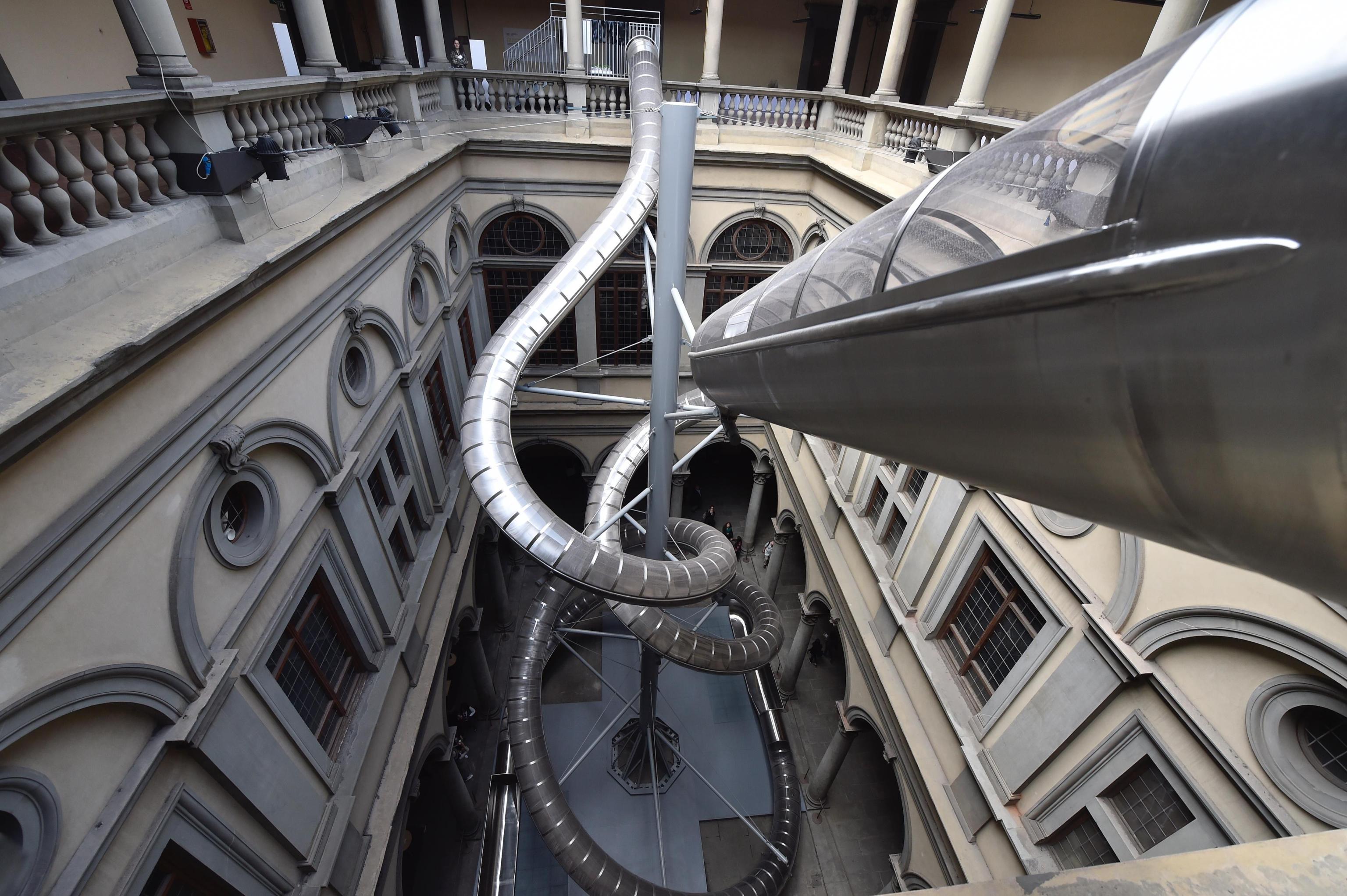 The structure 'The Florence Experiment' on display at Palazzo Strozzi in Florence, Italy, 17 April 2018. 'The Florence Experiment', running from 19 April to 26 August 2018, is an innovative research project carried out by German artist Carsten Höller and Italian plant neurobiologist Stefano Mancuso. Visitors will have the chance to slide down the structure from a height of 20 metres. Their emotional reactions will be recorded and compared with those of plants to examine the empathetic possibilities between humans and plant organisms. ANSA/ MAURIZIO DEGL' INNOCENTI