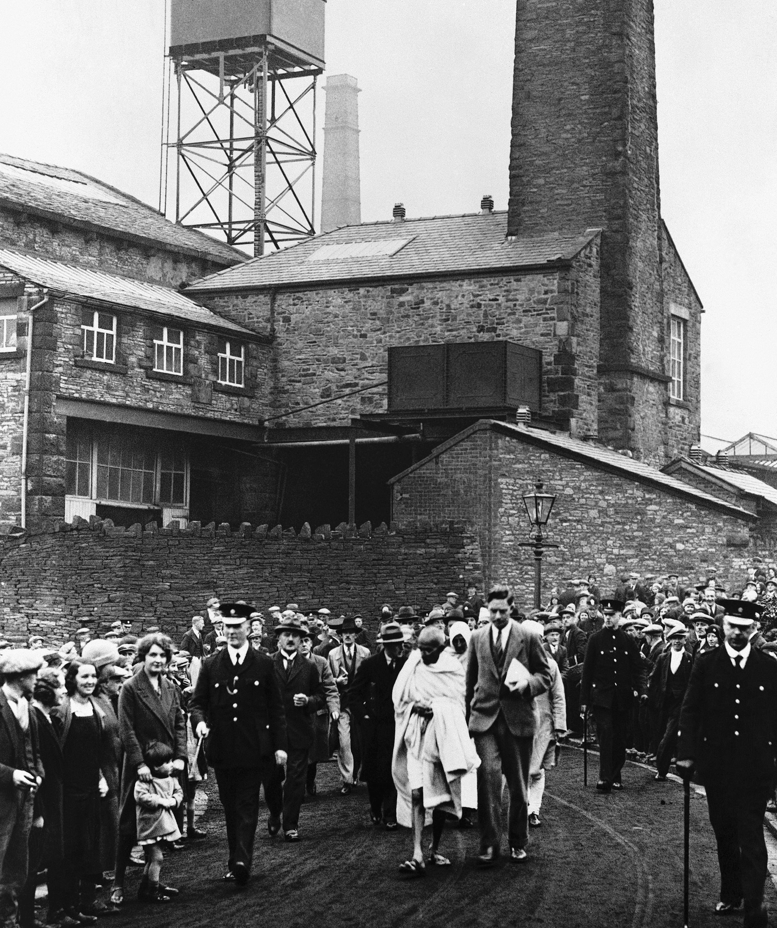 Mohandas Karamchand Gandhi leaving after he had toured Greenfield Mill near Darwen, England on Sept. 26, 1931, during his inspection of the Lancashire Cotton industry's labour conditions. (AP Photo/Staff/Puttnam)