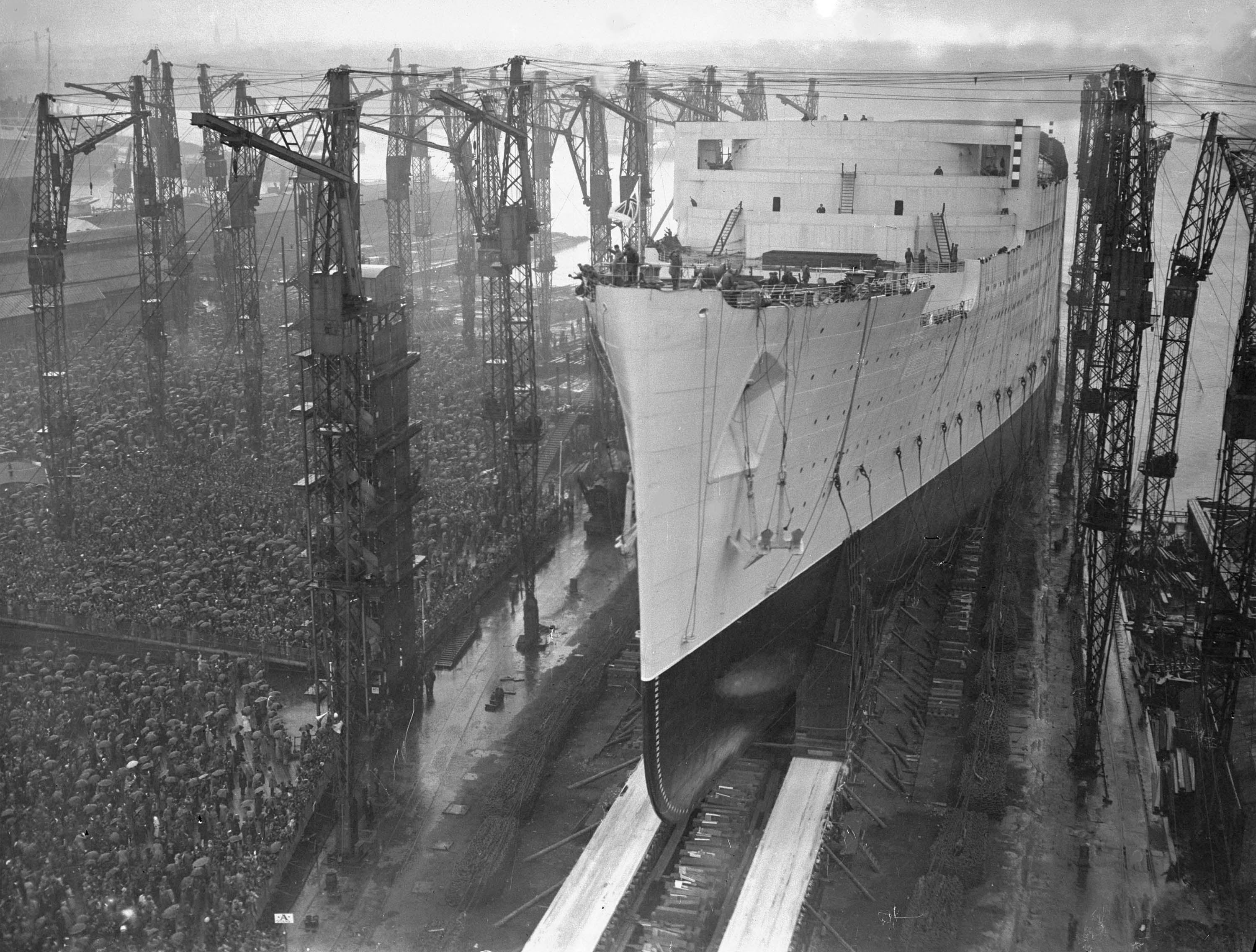 New Cunard liner, the Queen Mary, slides down the slipway during her launch at the John Brown Shipyard, Clydebank, Scotland, Sept. 26, 1934. The liner was launched by Her Majesty Queen Mary and was previously known just as Cunarder 534. (AP Photo/Sid Beadel)