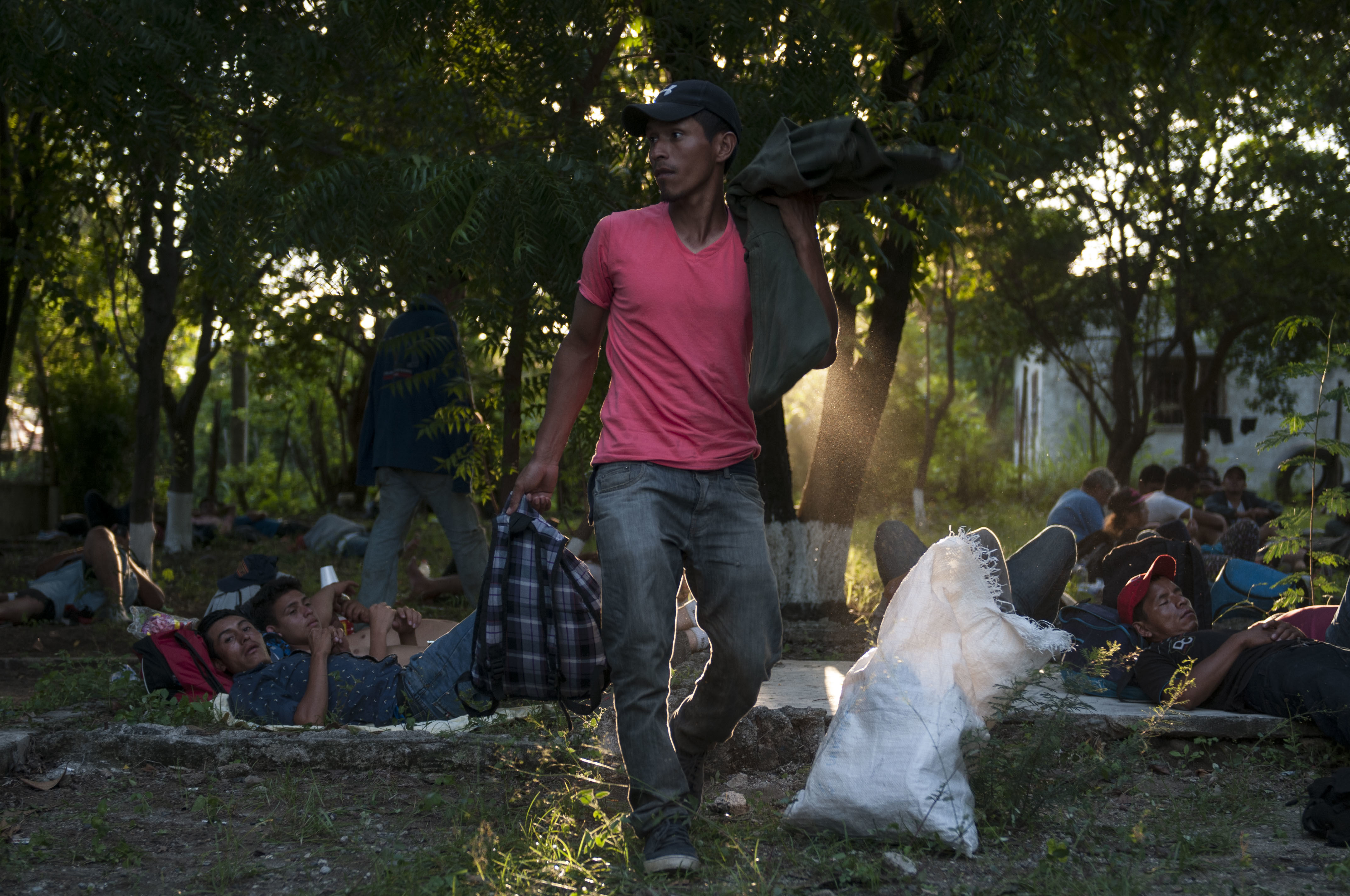 Honduran migrants walking in a caravan that aims to reach the U.S., rest in an abandoned spa resort near San Cristobal Acasaguastian, about 67 miles northeast of Guatemala City, Guatemala, Wednesday, Oct. 24, 2018. This new group of a few hundred Honduran migrants are behind the first caravan of Central American migrants that has swelled to thousands and is currently traveling through Mexico. (AP Photo/Oliver de Ros)