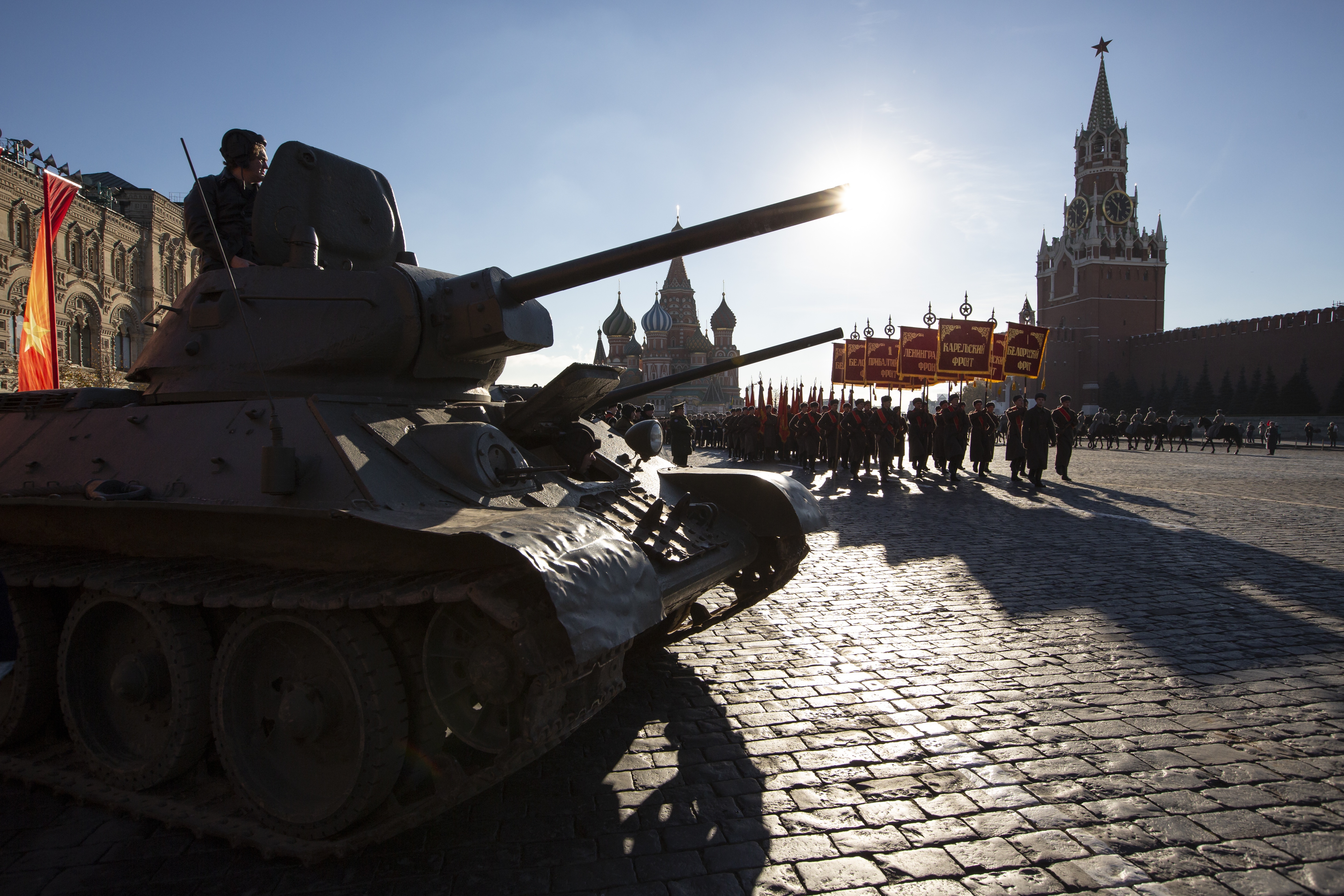 Russian soldiers dressed in Red Army World War II uniforms march during a rehearsal of the Nov. 7 parade in Red Square, with St. Basil Cathedral and the Spasskaya Tower in the background, in Moscow, Russia, Monday, Nov. 5, 2018. The parade marks the 77th anniversary of a World War II historic parade in Red Square and honored the participants in the Nov. 7, 1941 parade who headed directly to the front lines to defend Moscow from the Nazi forces. (AP Photo/Alexander Zemlianichenko)
