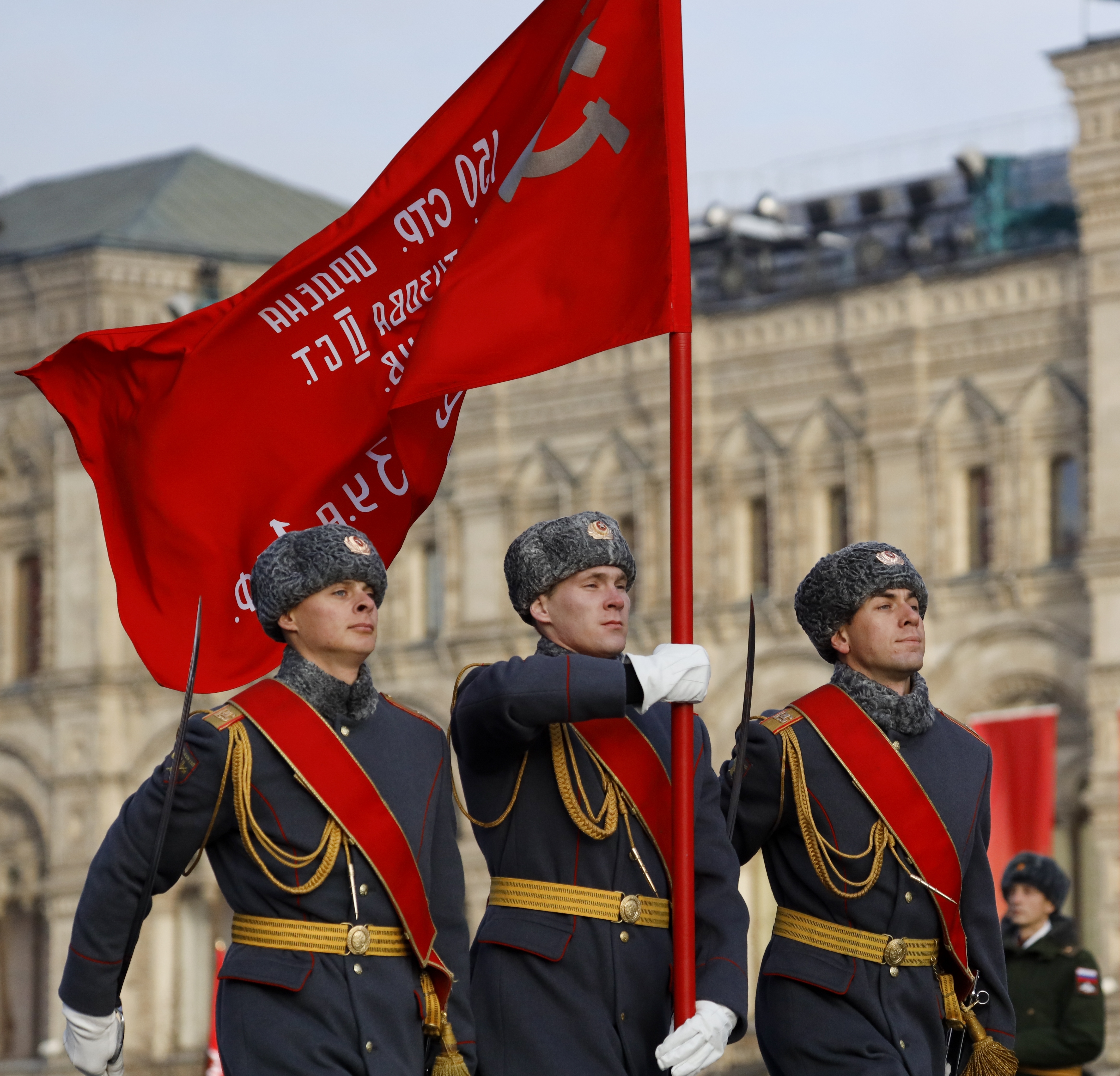 Russian soldiers march along Red Square during the Victory parade carrying the Victory in the WWII Flag during the Nov. 7 parade in Red Square, with St. Basil Cathedral and thew Spasskaya Tower in the background, in Moscow, Russia, Wednesday, Nov. 7, 2018. The event marked the 77th anniversary of a World War II historic parade in Red Square and honored the participants in the Nov. 7, 1941 parade who headed directly to the front lines to defend Moscow from the Nazi forces. (AP Photo/Alexander Zemlianichenko)