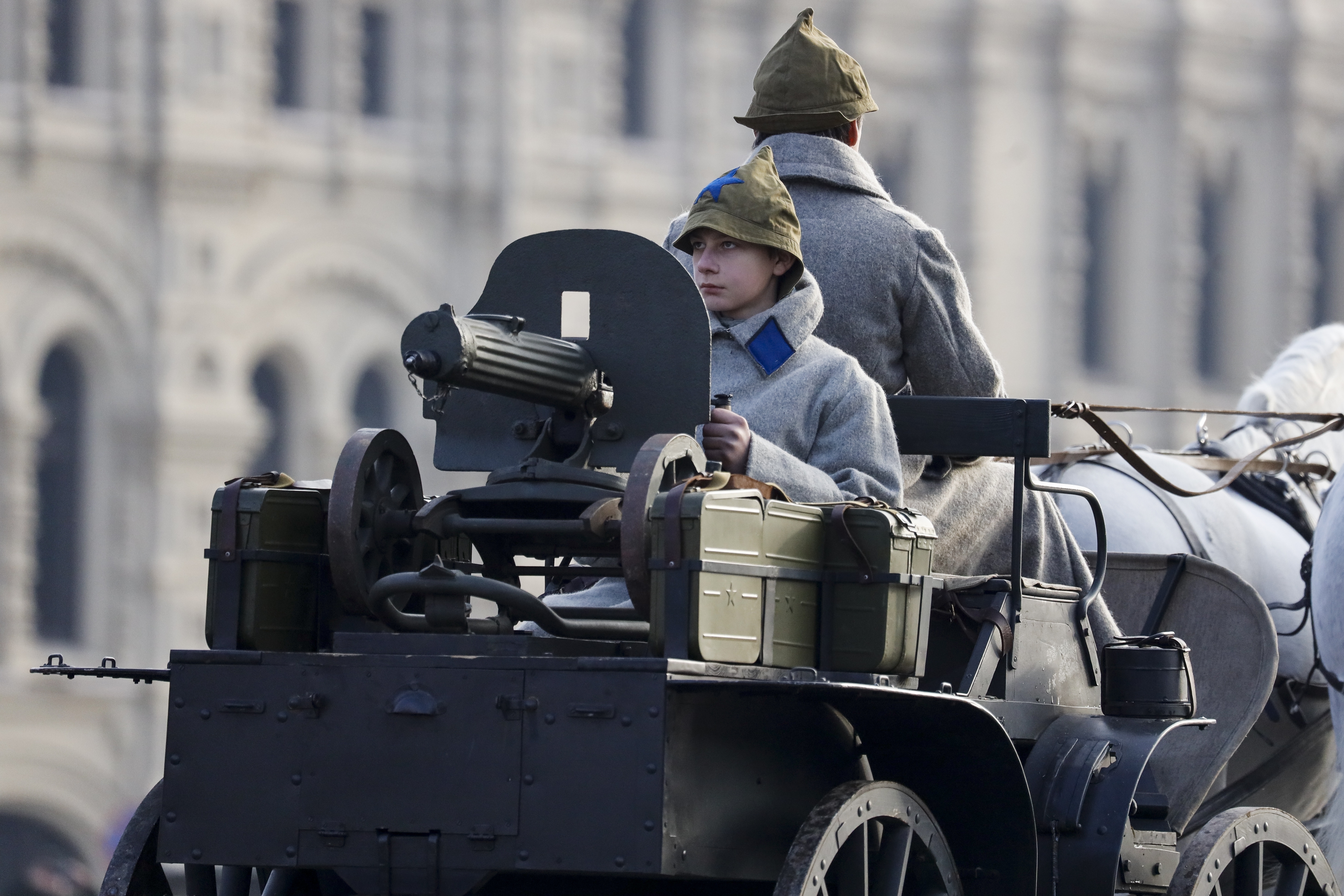 A volunteer dressed in a Red Army World War II uniform sits atop of a tachanka a horse-drawn machine gun, during the Nov. 7 parade in Red Square, in Moscow, Russia, Wednesday, Nov. 7, 2018. The parade marked the 77th anniversary of a World War II historic parade in Red Square and honored the participants in the Nov. 7, 1941 parade who headed directly to the front lines to defend Moscow from the Nazi forces. (AP Photo/Alexander Zemlianichenko)