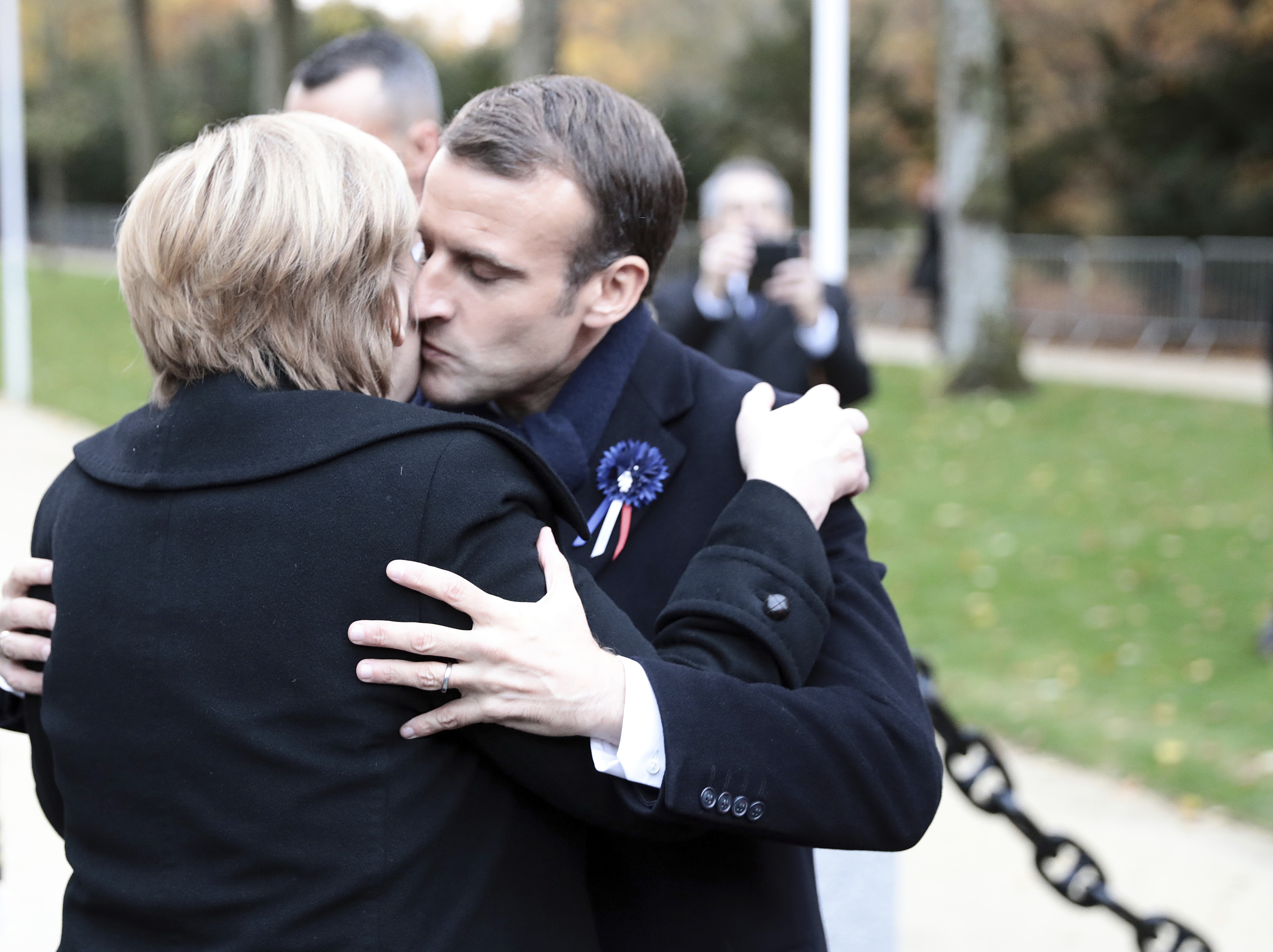 10 November 2018, France, Compiegne: Chancellor Angela Merkel (CDU) and French President Emmanuel Macron embrace near the northern French town of Compi'gne after commemorating the end of the First World War 100 years ago. The armistice was signed on 11 November 1918 in a converted dining car in the clearing. The memorial is located on this site. Photo by: Kay Nietfeld/picture-alliance/dpa/AP Images
