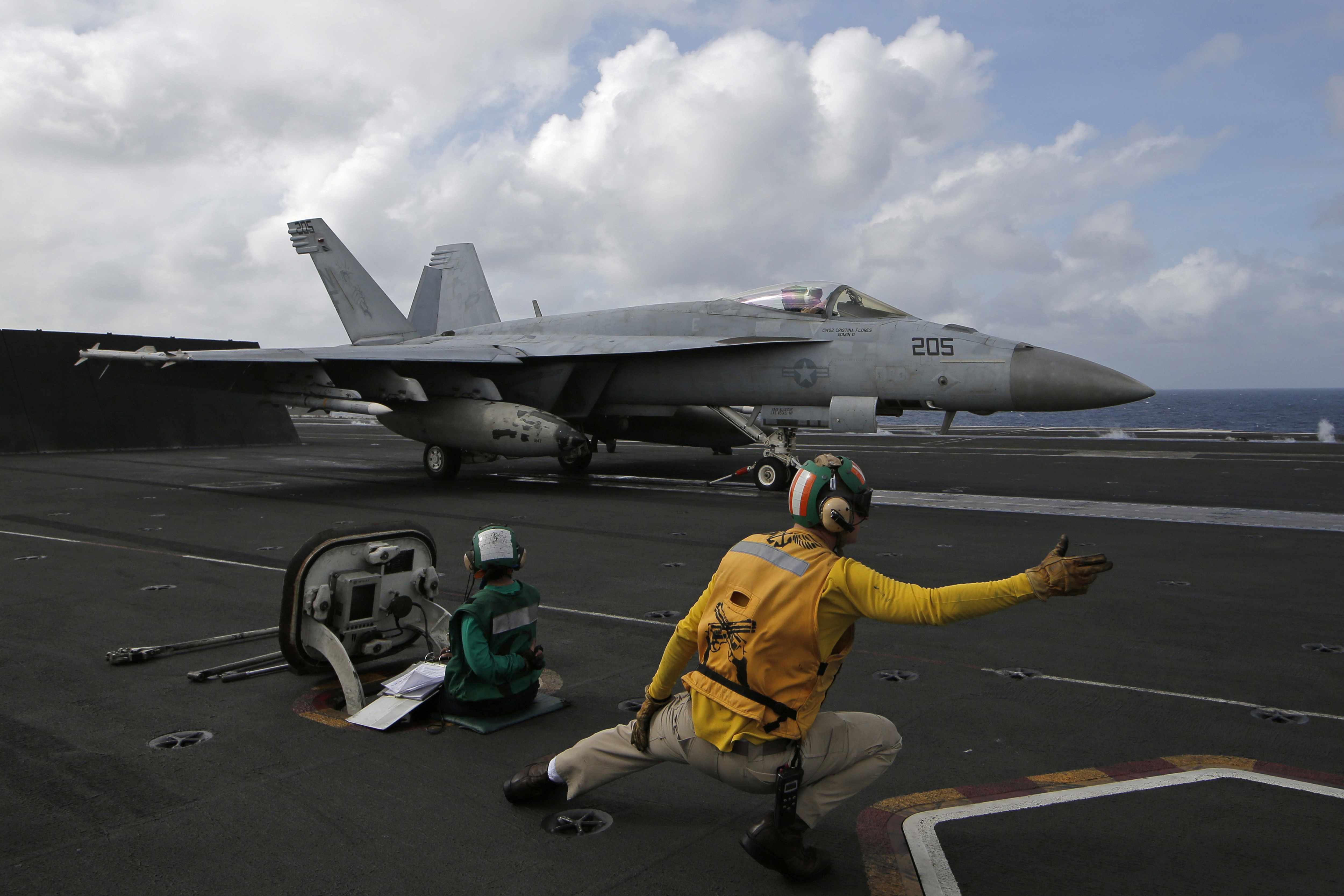 An F/A-18 Super Hornet fighter jet prepares to takes off on the deck of the U.S. Navy USS Ronald Reagan in the South China Sea, Tuesday, Nov. 20, 2018. China is allowing a U.S. Navy aircraft carrier and its battle group to make a port call in Hong Kong after it turned down similar request amid tensions with Washington.  (AP Photo/Kin Cheung)