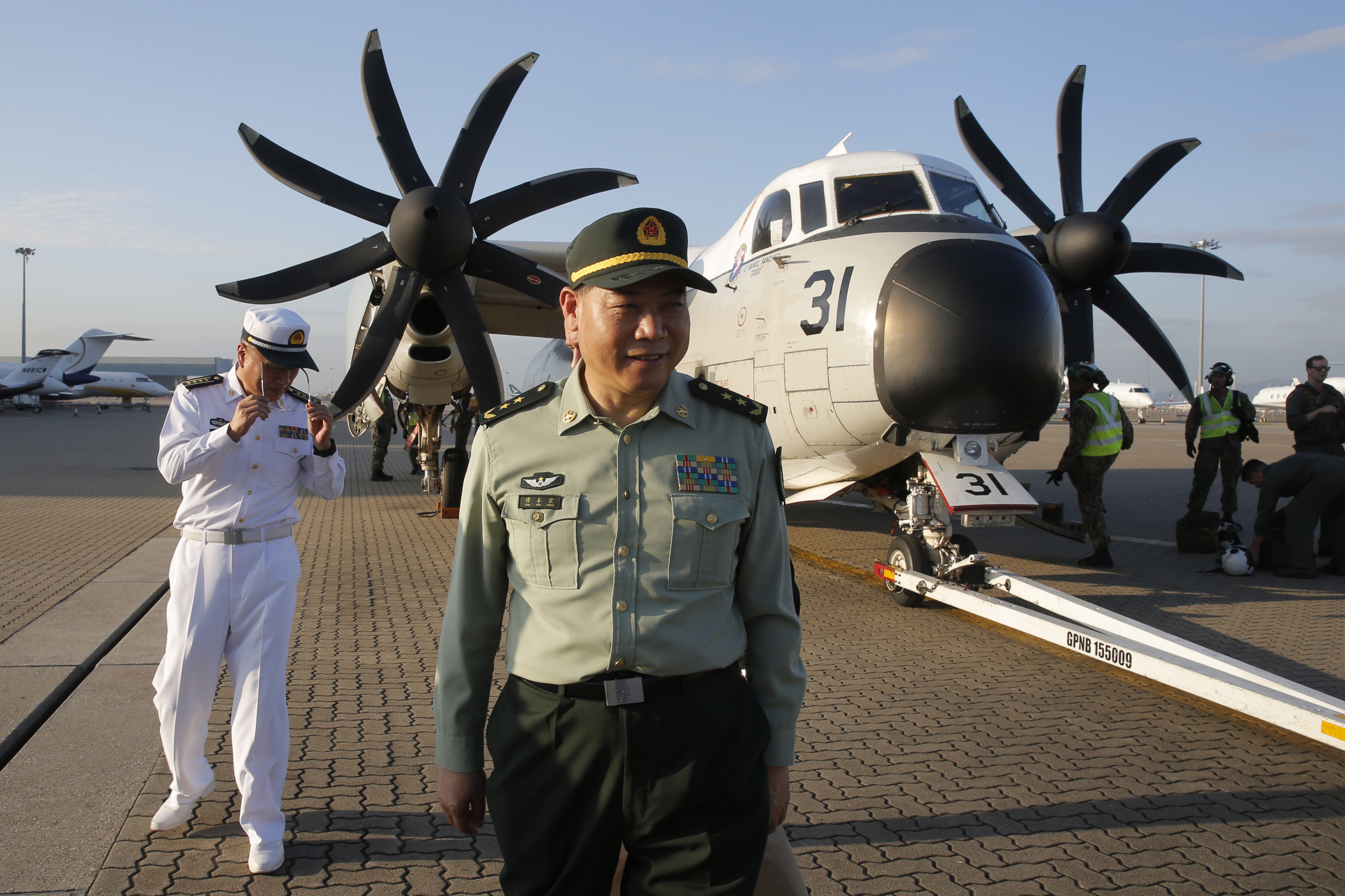 Tan Benhong, a lieutenant general of the People's Liberation Army (PLA) of China, arrives Hong Kong airport after visiting the U.S. Navy USS Ronald Reagan, in Hong Kong, Tuesday, Nov. 20, 2018. China is allowing the USS Reagan and its battle group to make a port call in Hong Kong after it earlier turned down a similar request amid tensions with Washington. (AP Photo/Kin Cheung)