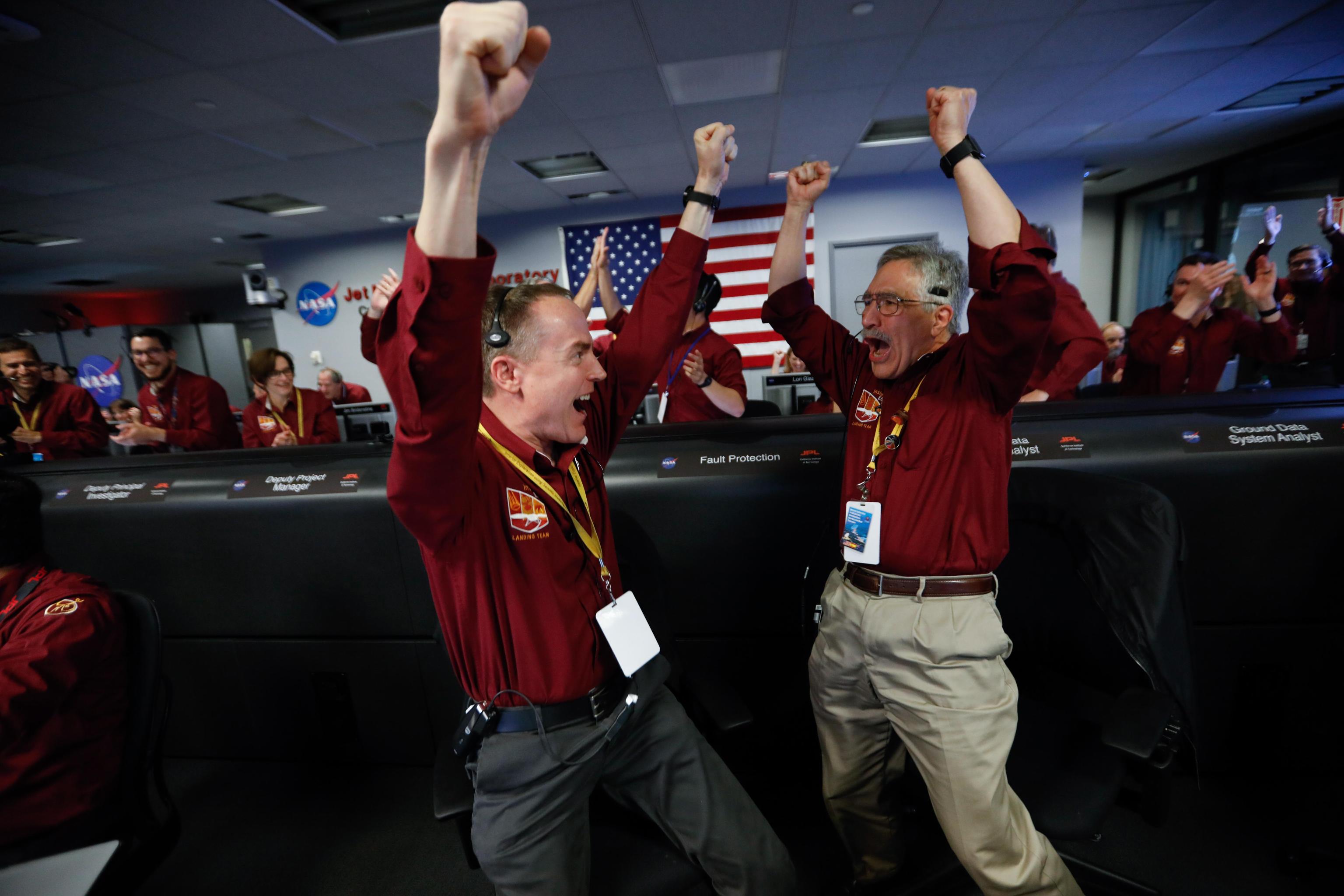 epa07191863 Mars InSight team members Kris Bruvold (L) and Sandy Krasner (R) react after receiving confirmation that the Mars InSight lander successfully touched down on the surface of Mars, inside the Mission Support Area at NASA's Jet Propulsion Laboratory in Pasadena, California, USA, 26 November 2018. InSight, short for Interior Exploration using Seismic Investigations, Geodesy and Heat Transport, is a Mars lander designed to study the 'inner space' of Mars: its crust, mantle, and core.  EPA/AL SEIB / POOL
