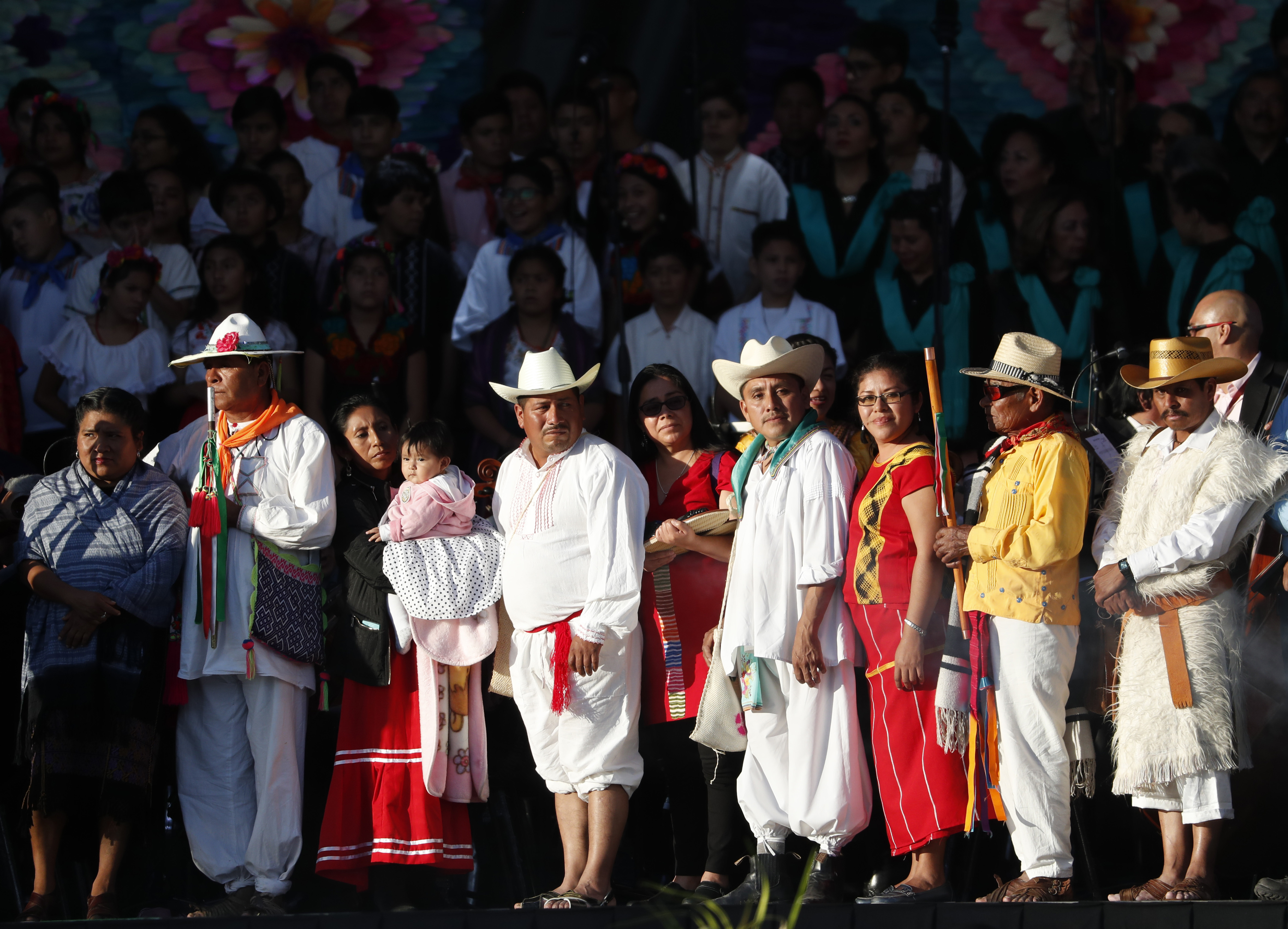 CORRECTS BYLINE - Indigenous religious leaders wait for Mexico's new President Andres Manuel Lopez Obrador for a traditional indigenous ceremony at the Zocalo, in Mexico City, Saturday, Dec. 1, 2018. Mexicans are getting more than just a new president Saturday. The inauguration of Lopez Obrador will mark a turning point in one of the world's most radical experiments in opening markets and privatization. (AP Photo/Moises Castillo)