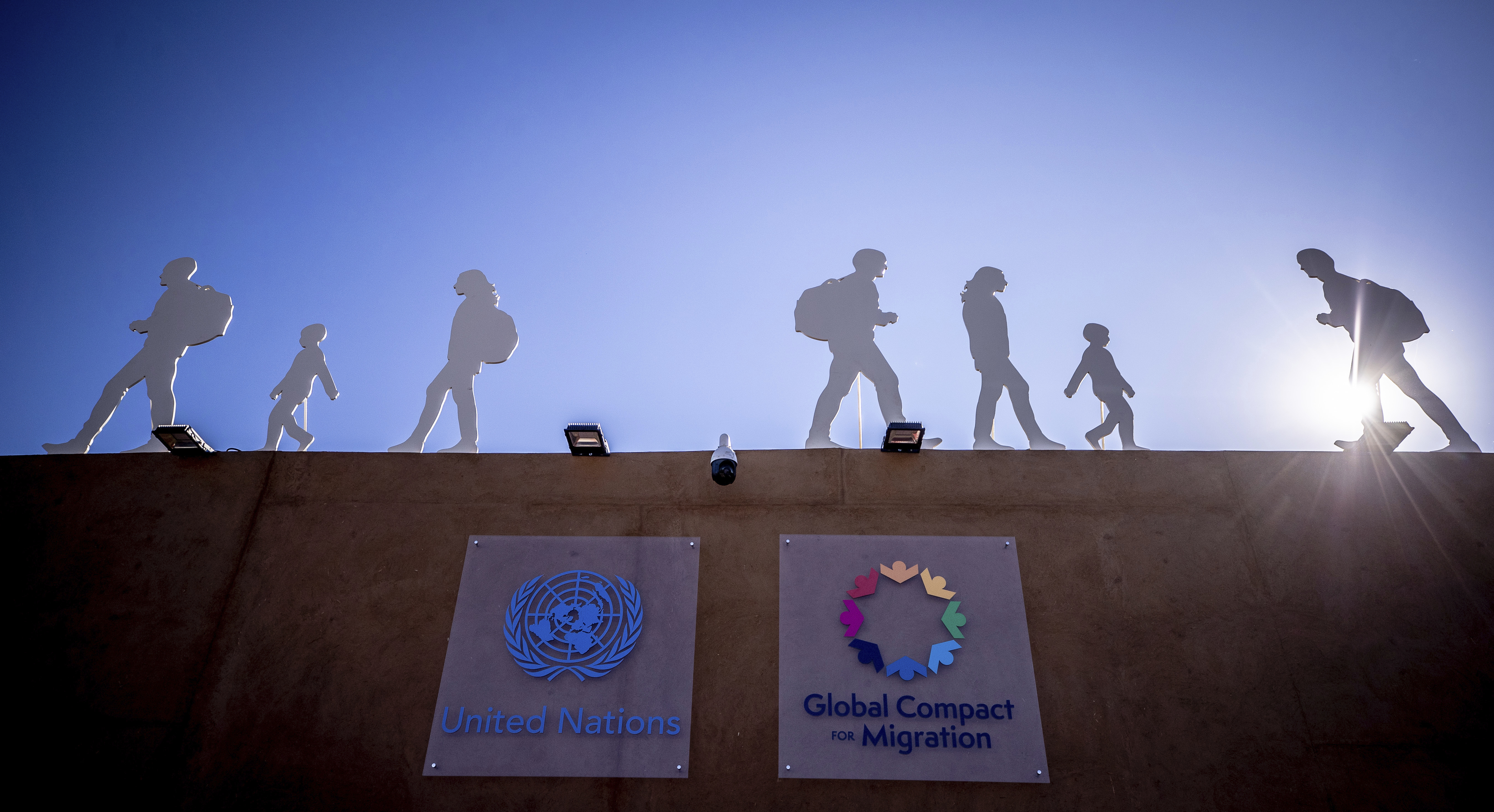 10 December 2018, Morocco, Marrakesch: Displays with silhouettes of migrants stand on the grounds of the UN Conference on the Migration Pact. Chancellor Merkel (CDU) has praised the UN Migration Pact as a milestone in international migration policy. Photo by: Michael Kappeler/picture-alliance/dpa/AP Images