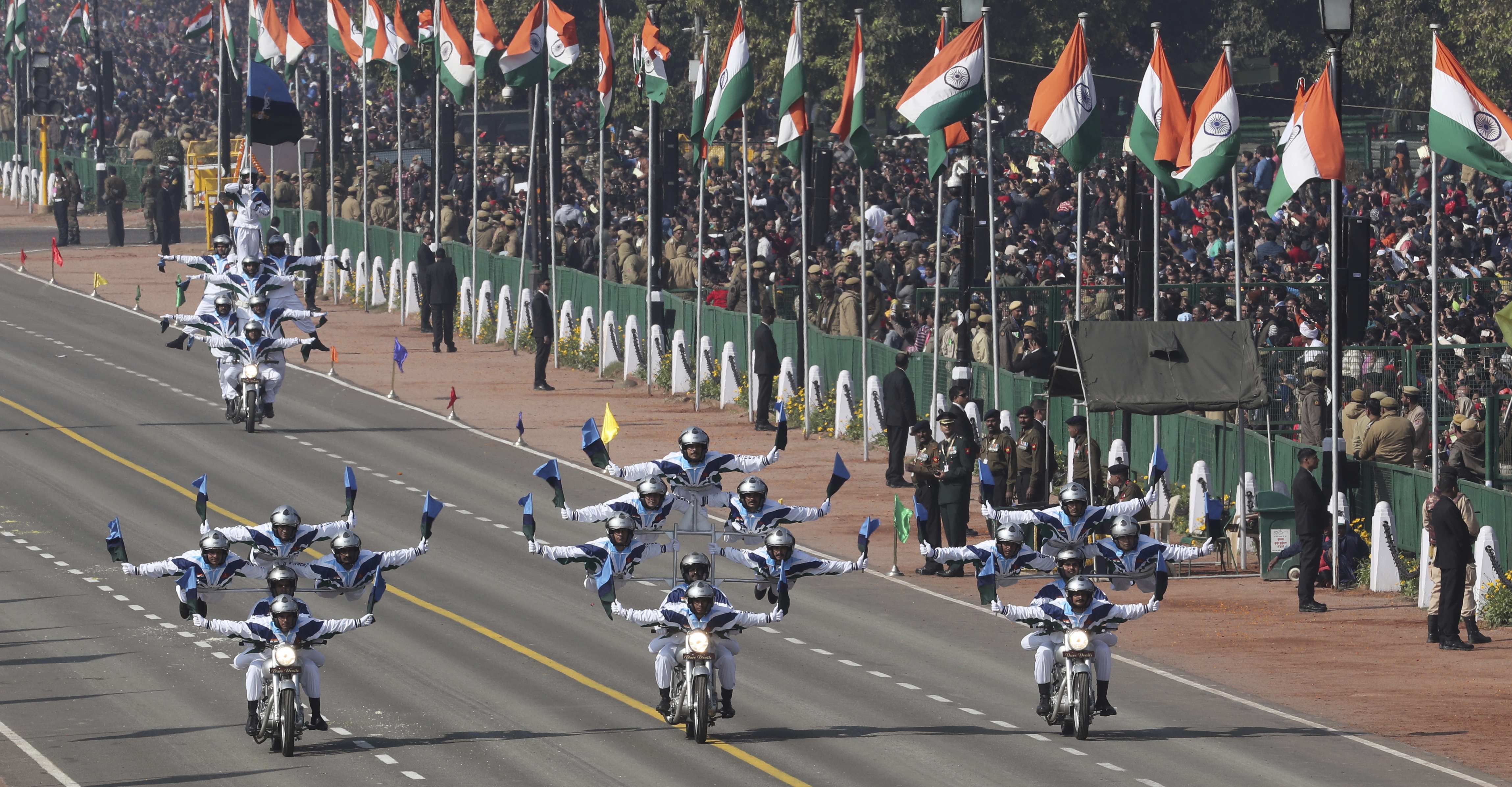 Daredevils from the Indian Army Corps of Signals display their skills on motorcycles on Rajpath, the ceremonial boulevard, during Republic Day parade in New Delhi, India, Saturday, Jan. 26, 2019. Thousands of Indians have converged on a ceremonial boulevard to watch a display of the country's military power and cultural diversity amid tight security during national day celebrations. (AP Photo/Manish Swarup)