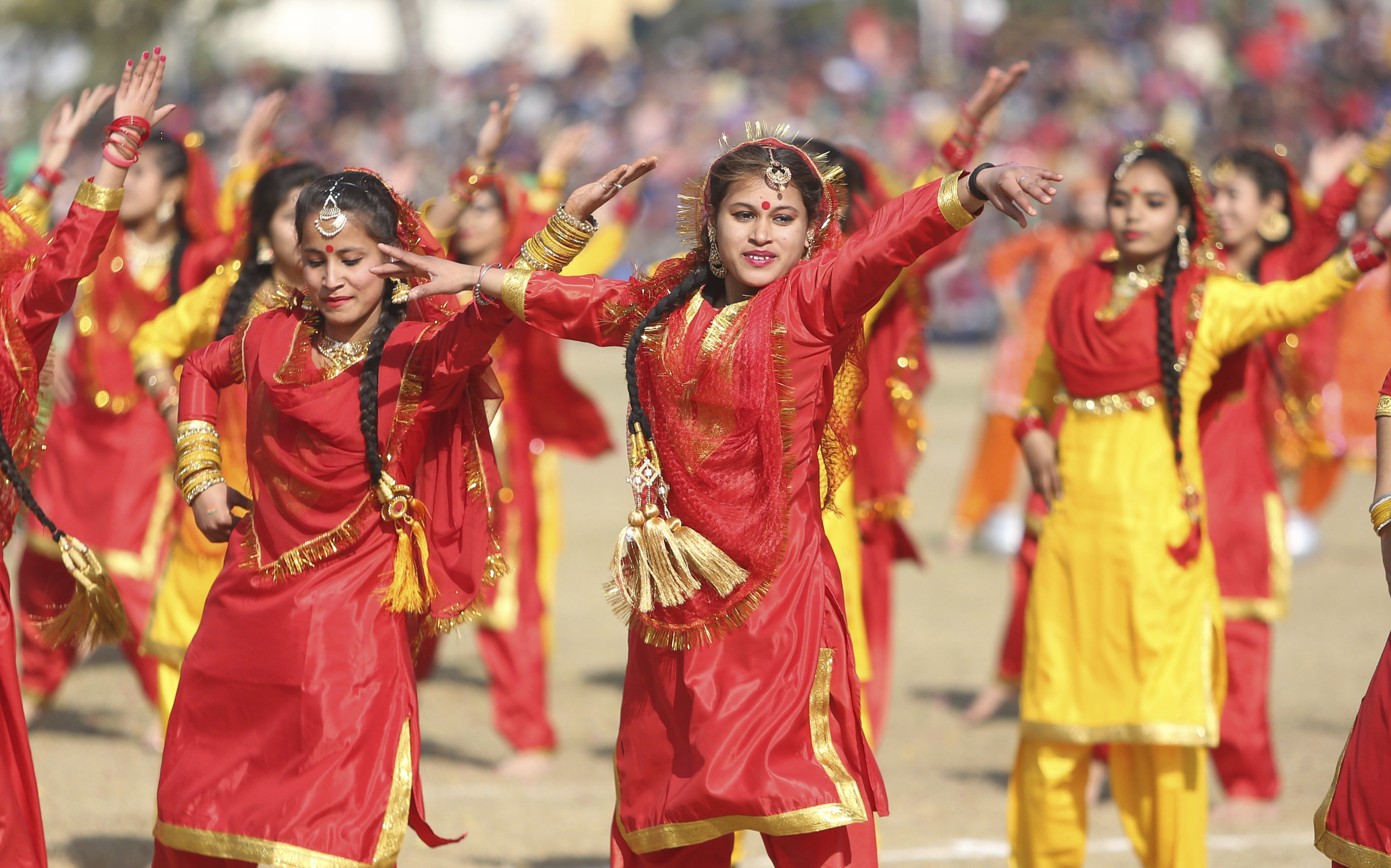 Schoolgirls dance during a celebration of Republic Day parade in Jammu, India, Saturday, Jan. 26, 2019. (AP Photo/Channi Anand)