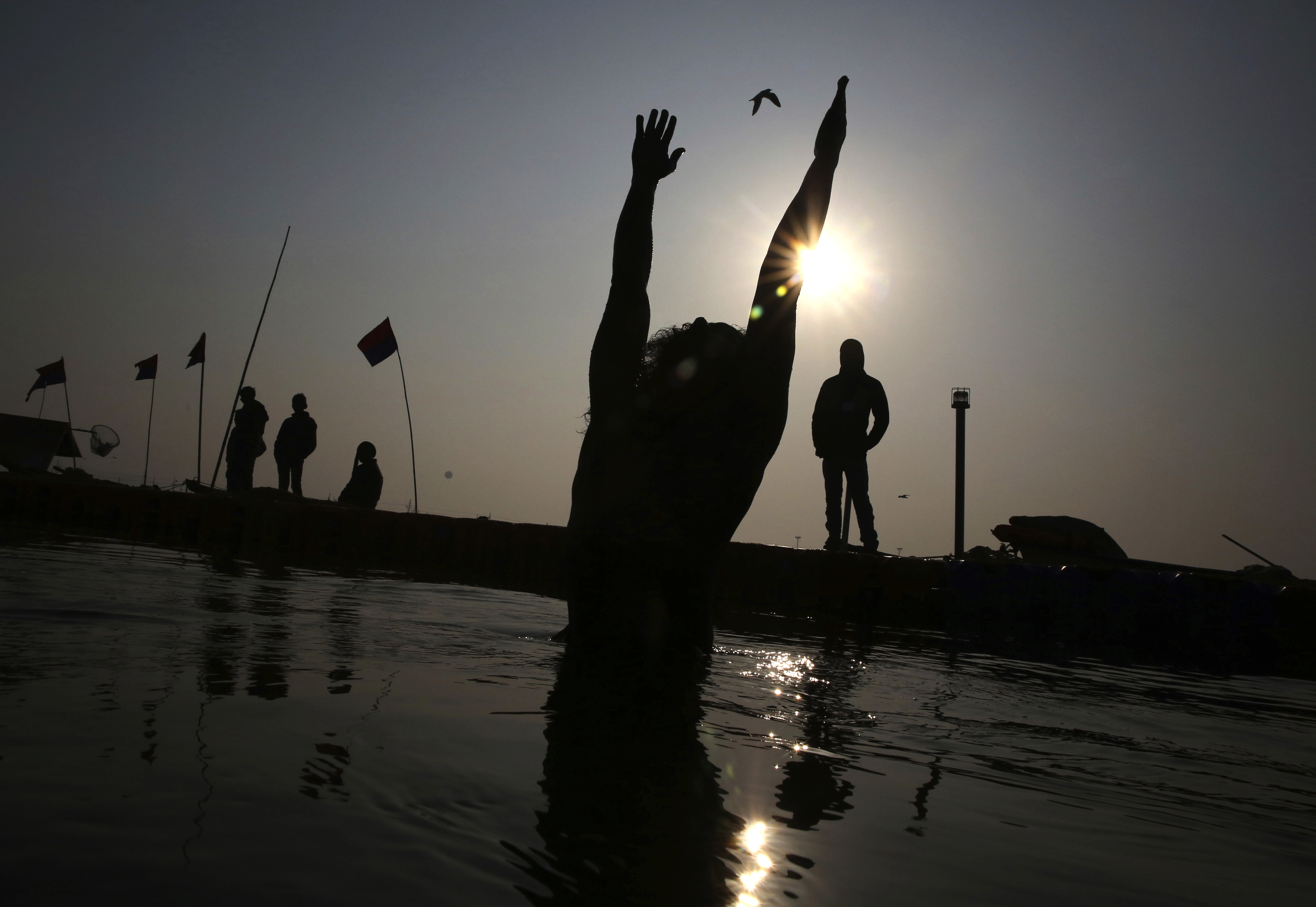 A Hindu devotees takes ritualistic dips at Sangam during Kumbh Mela or Pitcher festival at Prayagraj Uttar Pradesh state, India, Monday, Jan. 21, 2019. The Kumbh Mela is a series of ritual baths by Hindu holy men, and other pilgrims at Sangam, the confluence of three sacred rivers the Yamuna, the Ganges and the mythical Saraswati that dates back to at least medieval times. The city's Mughal-era name Allahabad was recently changed to Prayagraj. (AP Photo/Rajesh Kumar Singh)