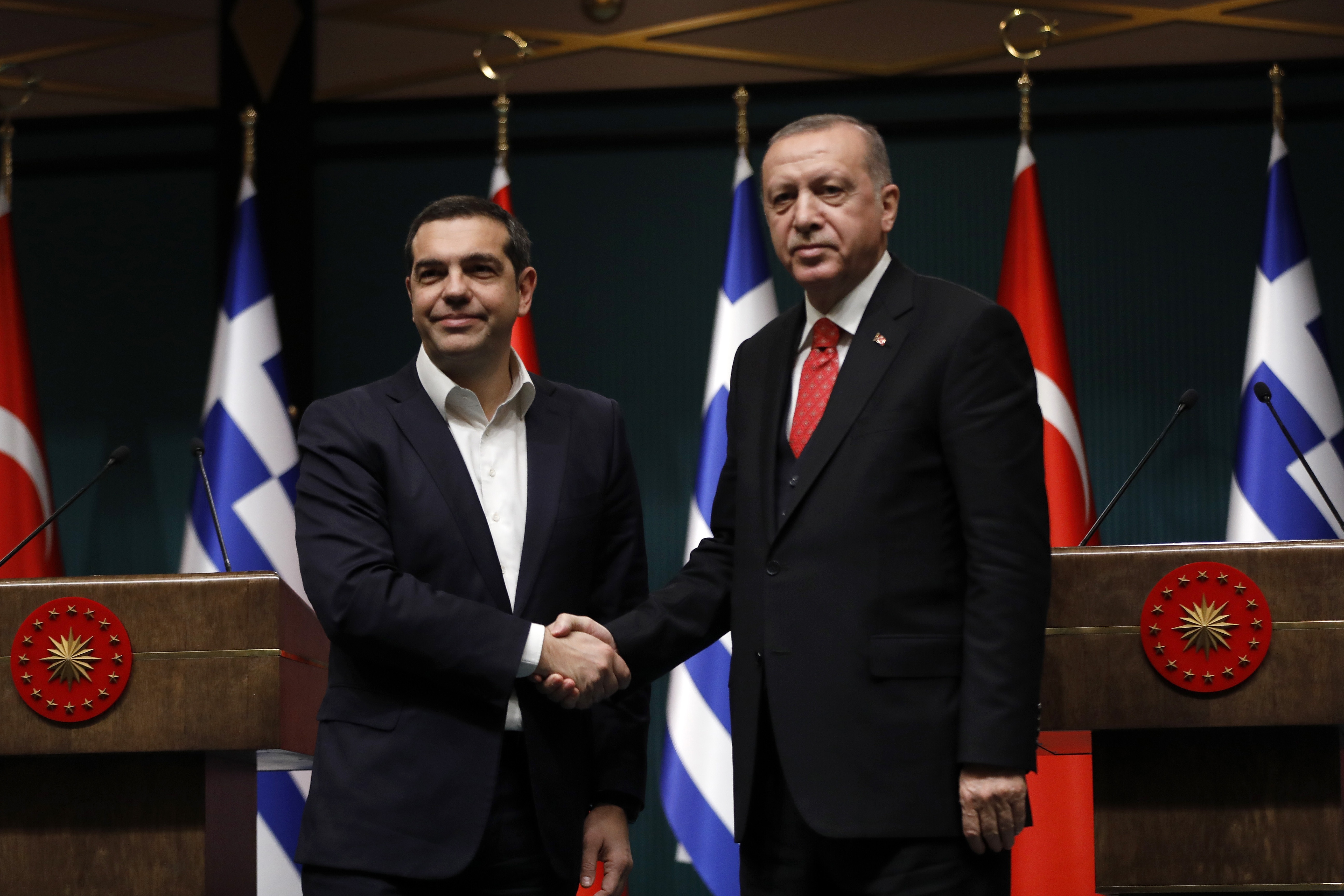 Turkey's President Recep Tayyip Erdogan, right, and Greece's Prime Minister Alexis Tsipras shake hands after their press conference at the Presidential Palace in Ankara, Tuesday, Feb. 5, 2019. Tsipras and Erdogan are set to discuss an array of subjects that have strained relations between the two NATO allies, including territorial disputes in the Aegean Sea and gas exploration in the eastern Mediterranean. (AP Photo/Burhan Ozbilici)