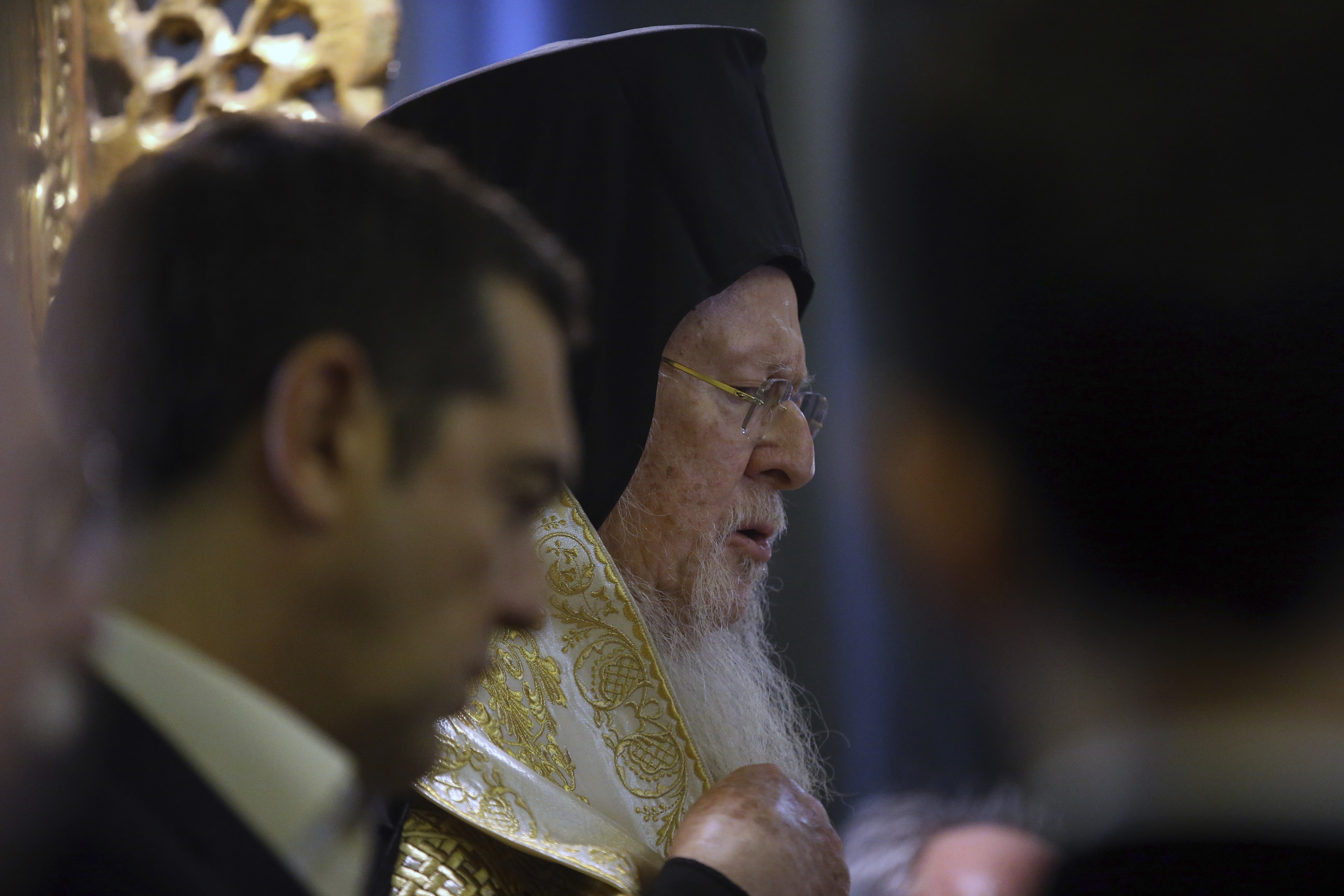Ecumenical Patriarch Bartholomew I, right, and Greece's Prime Minister Alexis Tsipras attend a church service during their visit at the Theological School of Halki, in Heybeli Island, near Istanbul, Wednesday, Feb. 6, 2019. The president of Turkey and the prime minister of Greece agreed Tuesday on the need to keep 