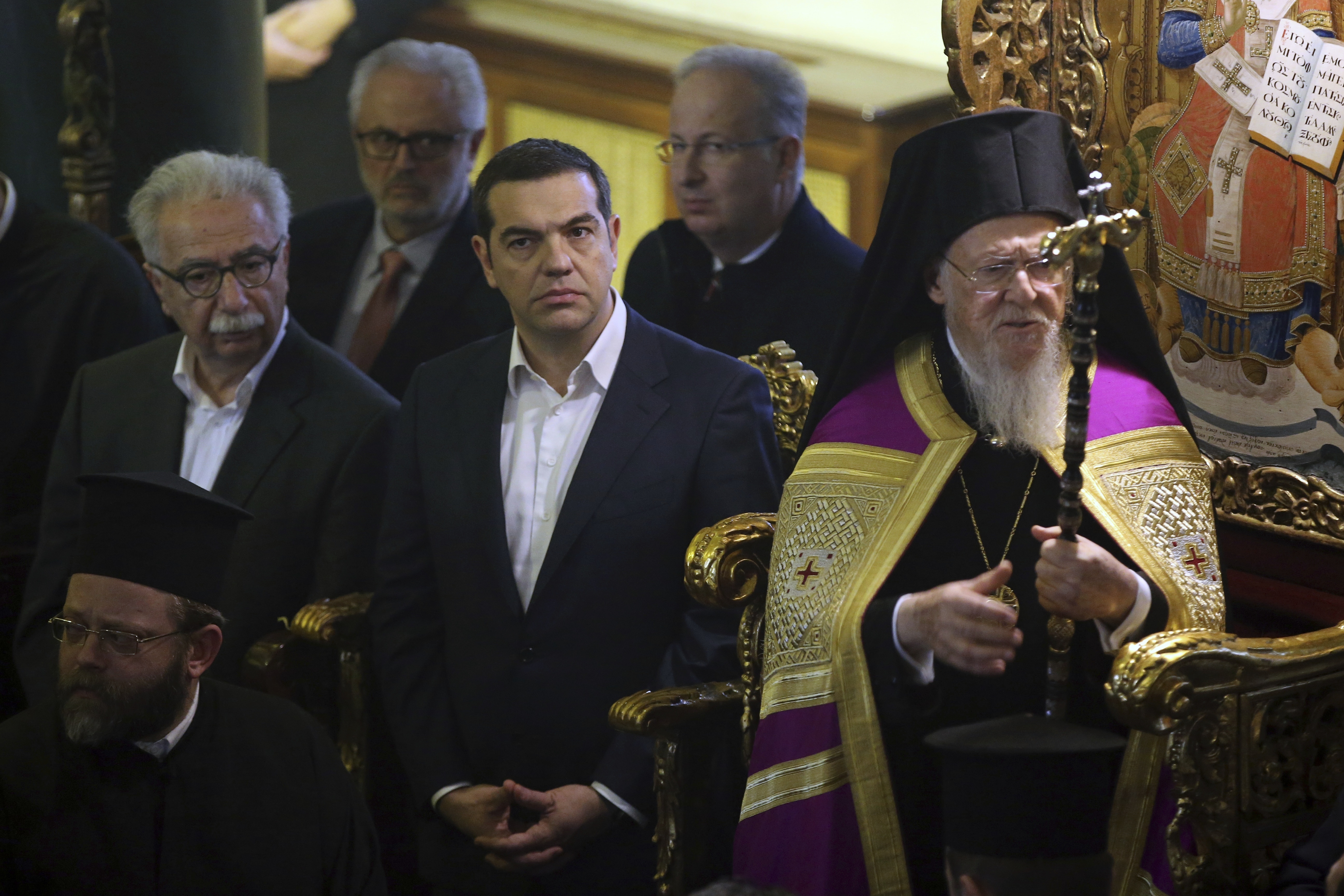 Ecumenical Patriarch Bartholomew I, right, and Greece's Prime Minister Alexis Tsipras, center, attend a church service during their visit at the Theological School of Halki, in Heybeli Island, near Istanbul, Wednesday, Feb. 6, 2019. The president of Turkey and the prime minister of Greece agreed Tuesday on the need to keep 