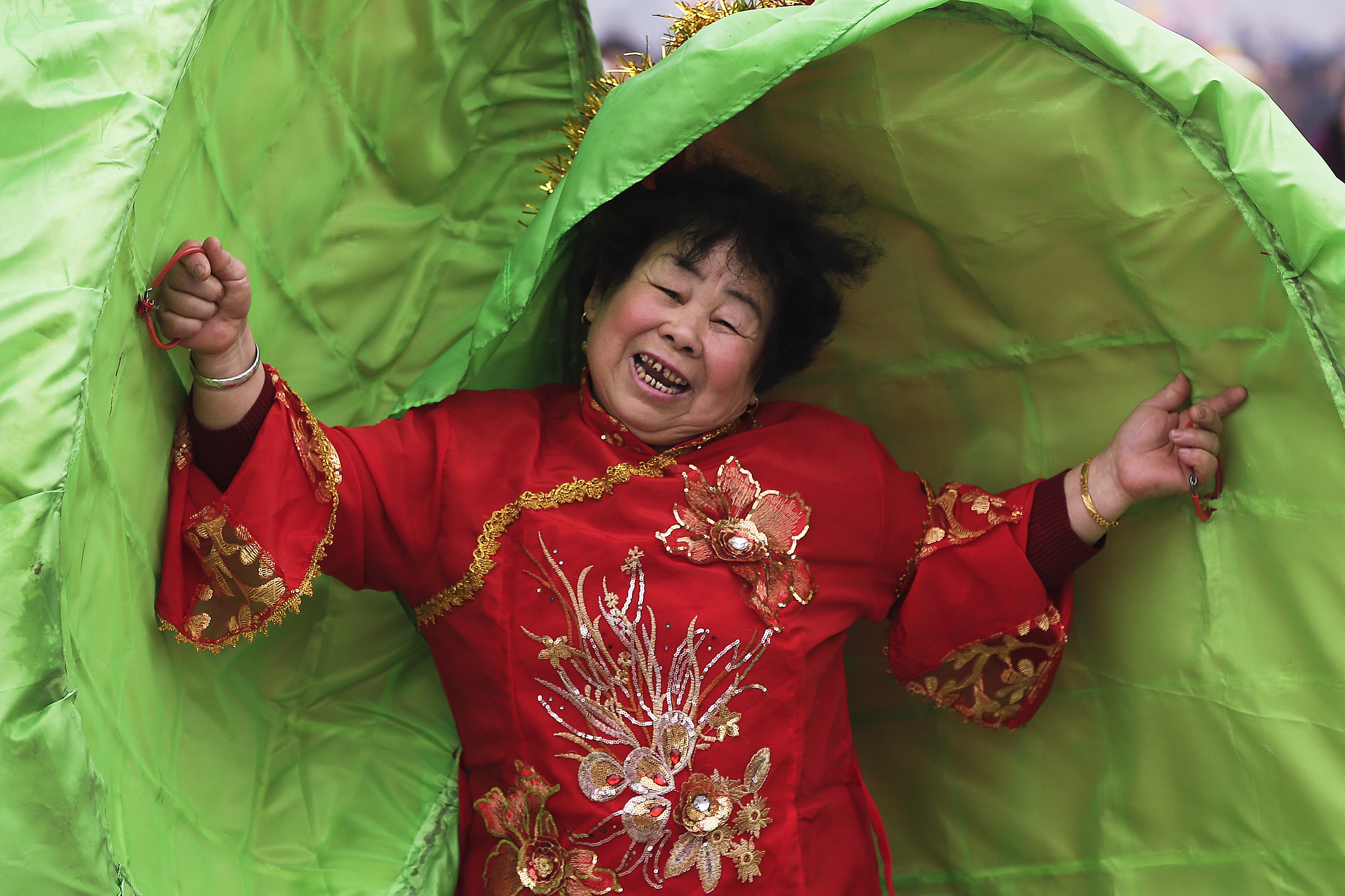 A performer dressed in traditional costume participates in a cultural dance during the Lantern Festival organized by city government at a square in Yufa town of Beijing's Daxing district, Tuesday, Feb. 19, 2019. Tuesday is the Lantern Festival in China, the final day of the annual celebration of the Chinese Lunar New Year. (AP Photo/Andy Wong)