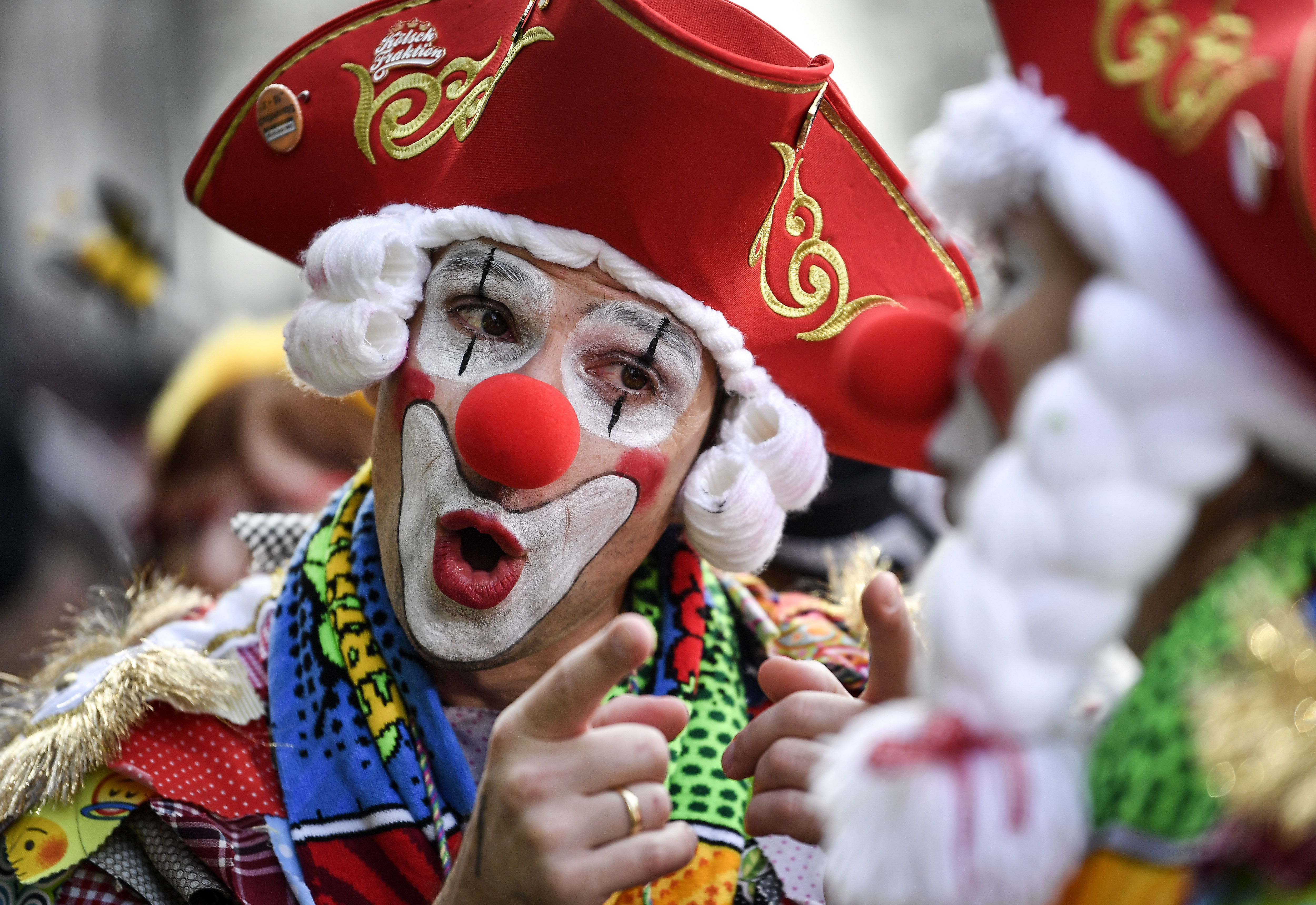 Revelers celebrate in Cologne's city center when thousands of revelers dressed in carnival costumes celebrate the start of the street carnival in Cologne, Germany, Thursday, Feb. 28, 2019. (AP Photo/Martin Meissner)