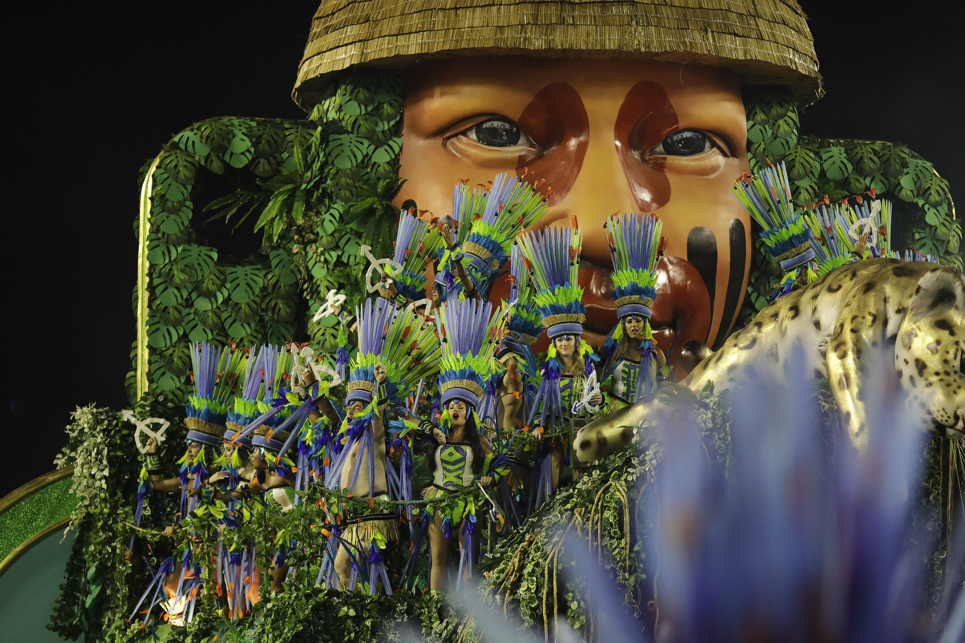Performers from the Mangueira samba school parade on a float during Carnival celebrations at the Sambadrome in Rio de Janeiro, Brazil, Tuesday, March 5, 2019. (AP Photo/Leo Correa)