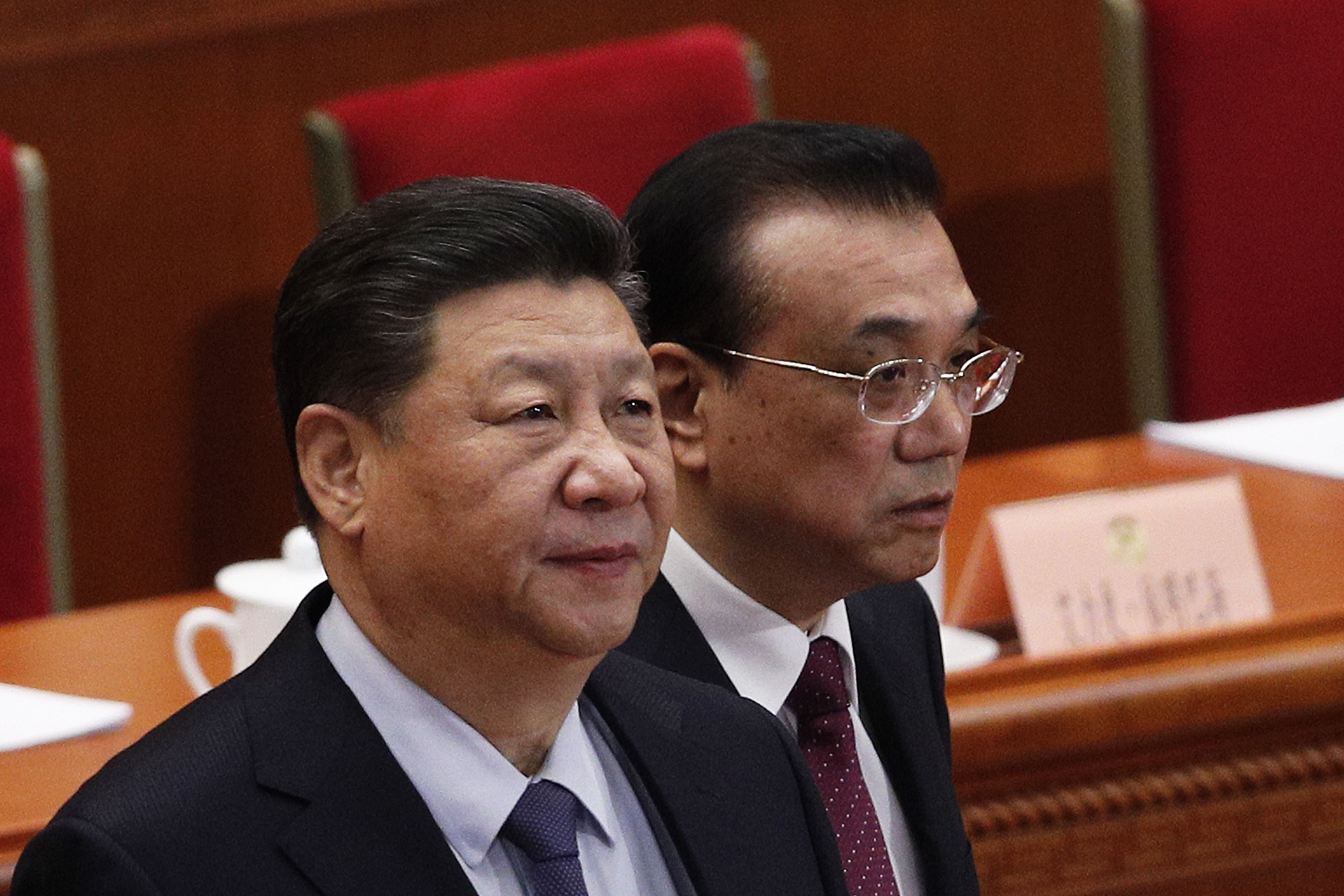 Chinese President Xi Jinping, left, and Premier Li Keqiang arrive for the closing session of the Chinese People's Political Consultative Conference (CPPCC) at the Great Hall of the People in Beijing, Wednesday, March 13, 2019. (AP Photo/Andy Wong)