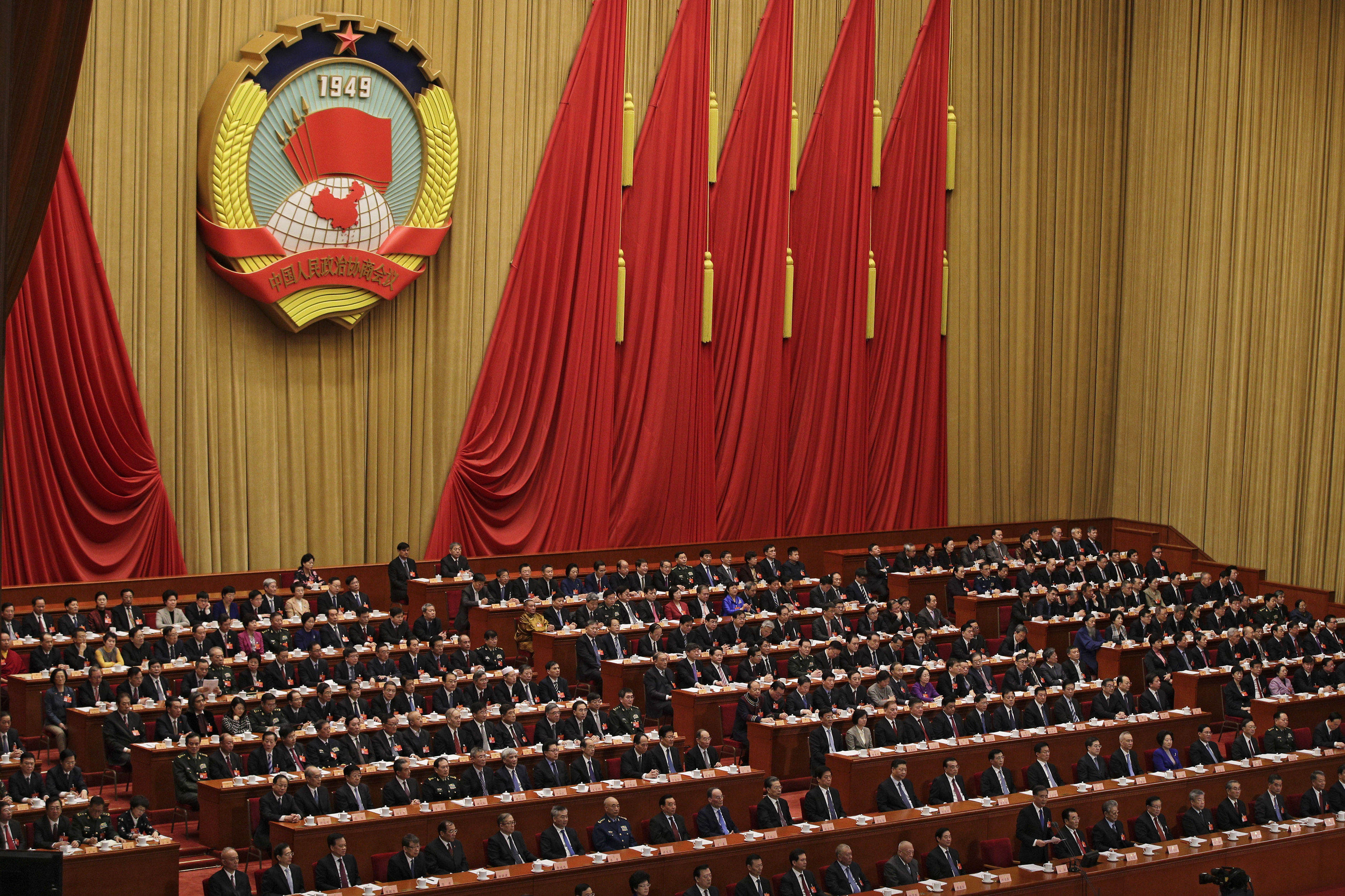 Chinese People's Political Consultative Conference (CPPCC) chairman and Politburo Standing Committee member Wang Yang delivers a closing speech for the Chinese People's Political Consultative Conference (CPPCC) at the Great Hall of the People in Beijing, Wednesday, March 13, 2019. (AP Photo/Andy Wong)