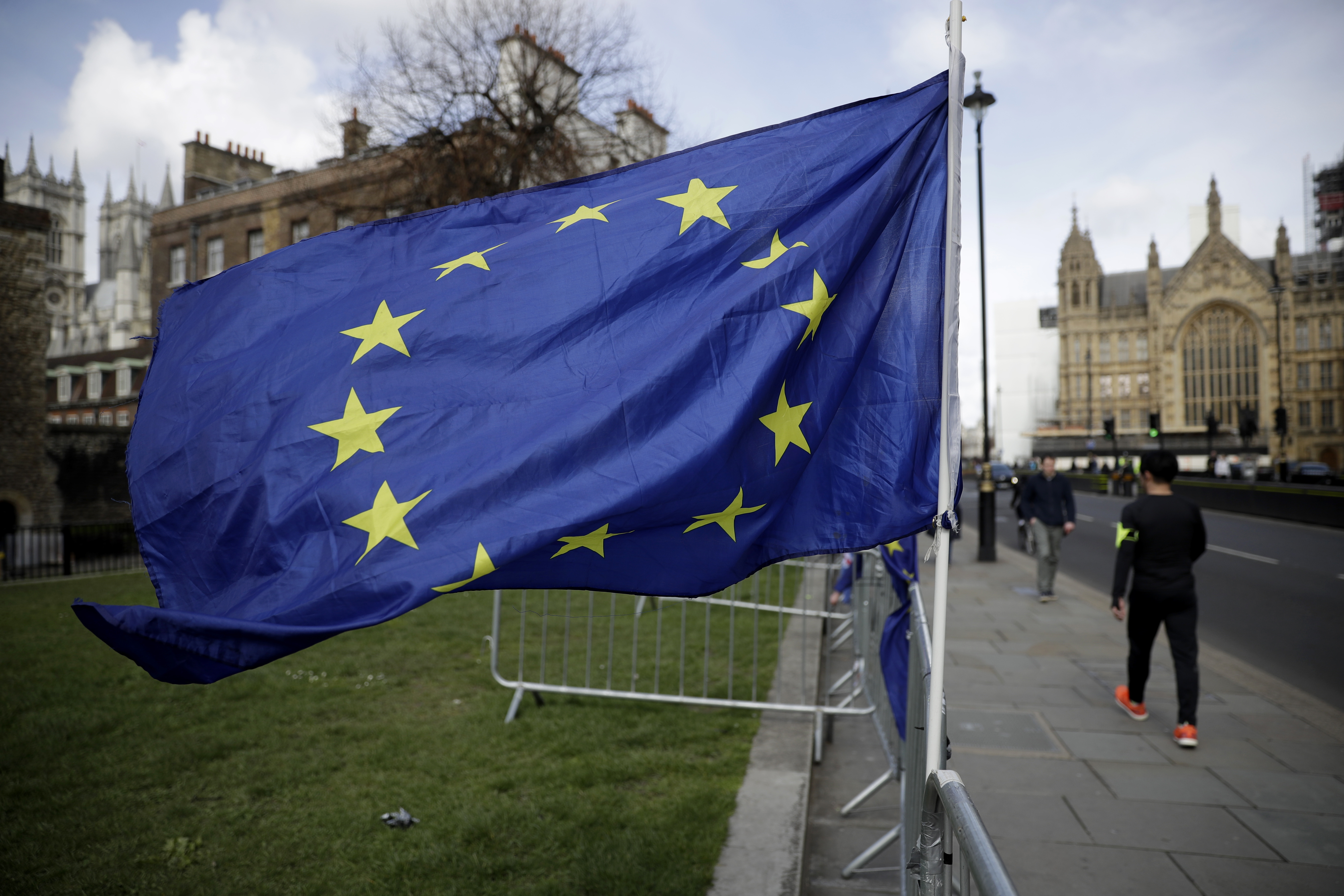 A European flag placed by anti-Brexit remain in the European Union supporters flies backdropped by the Houses of Parliament, at right, in London, Monday, March 18, 2019. British Prime Minister Theresa May was making a last-minute push Monday to win support for her European Union divorce deal, warning opponents that failure to approve it would mean a long — and possibly indefinite — delay to Brexit. Parliament has rejected the agreement twice, but May aims to try a third time this week if she can persuade enough lawmakers to change their minds. (AP Photo/Matt Dunham)