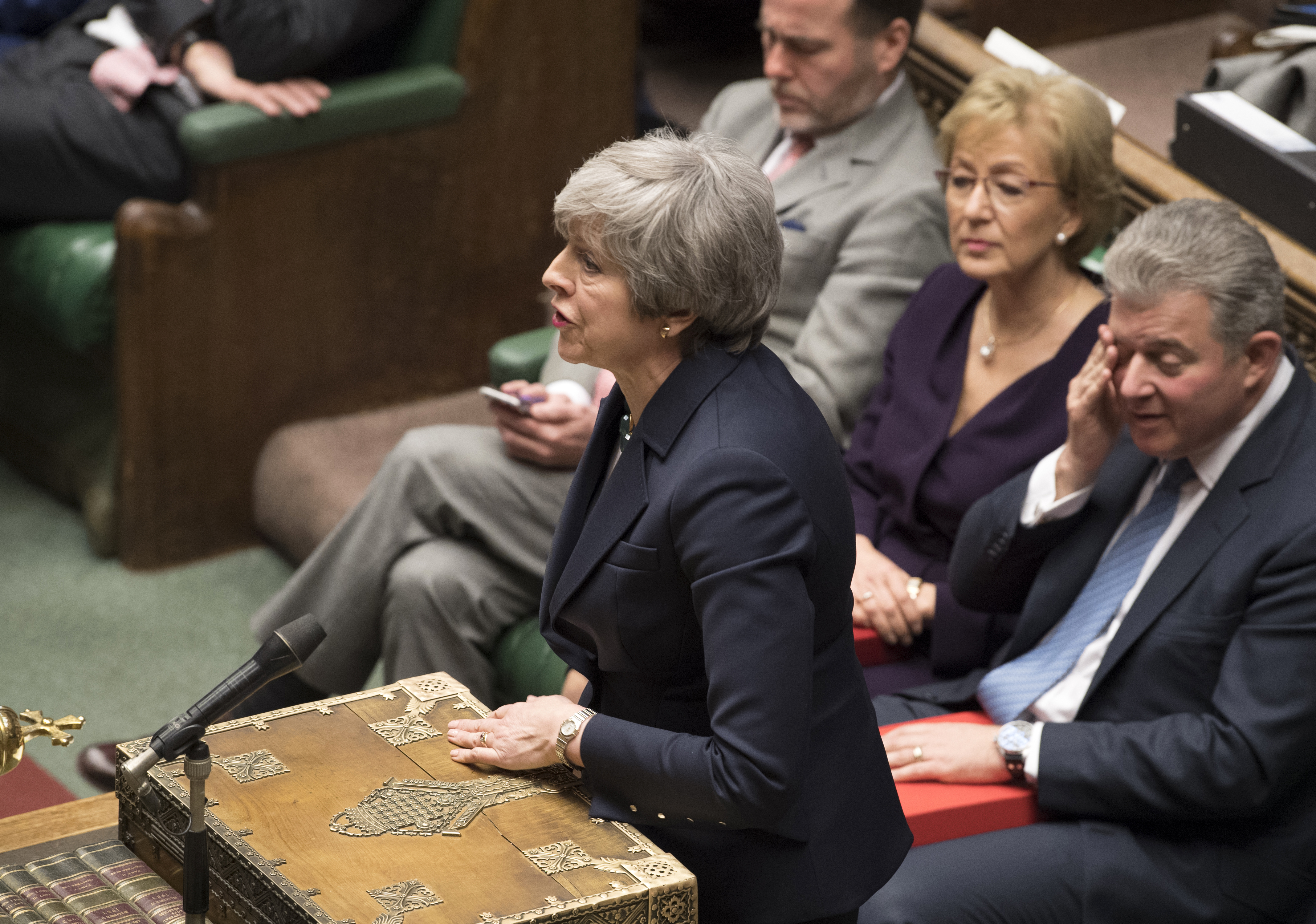 Britain's Prime Minister Theresa May at center right front row, speaks to lawmakers in the House of Commons, London, Wednesday March 13, 2019. Political crisis in Britain is sparking anxiety across the European Union, as fears rise that Britain will crash out of the bloc on March 29 without a withdrawal agreement to smooth the way. (Mark Duffy/UK Parliament via AP)