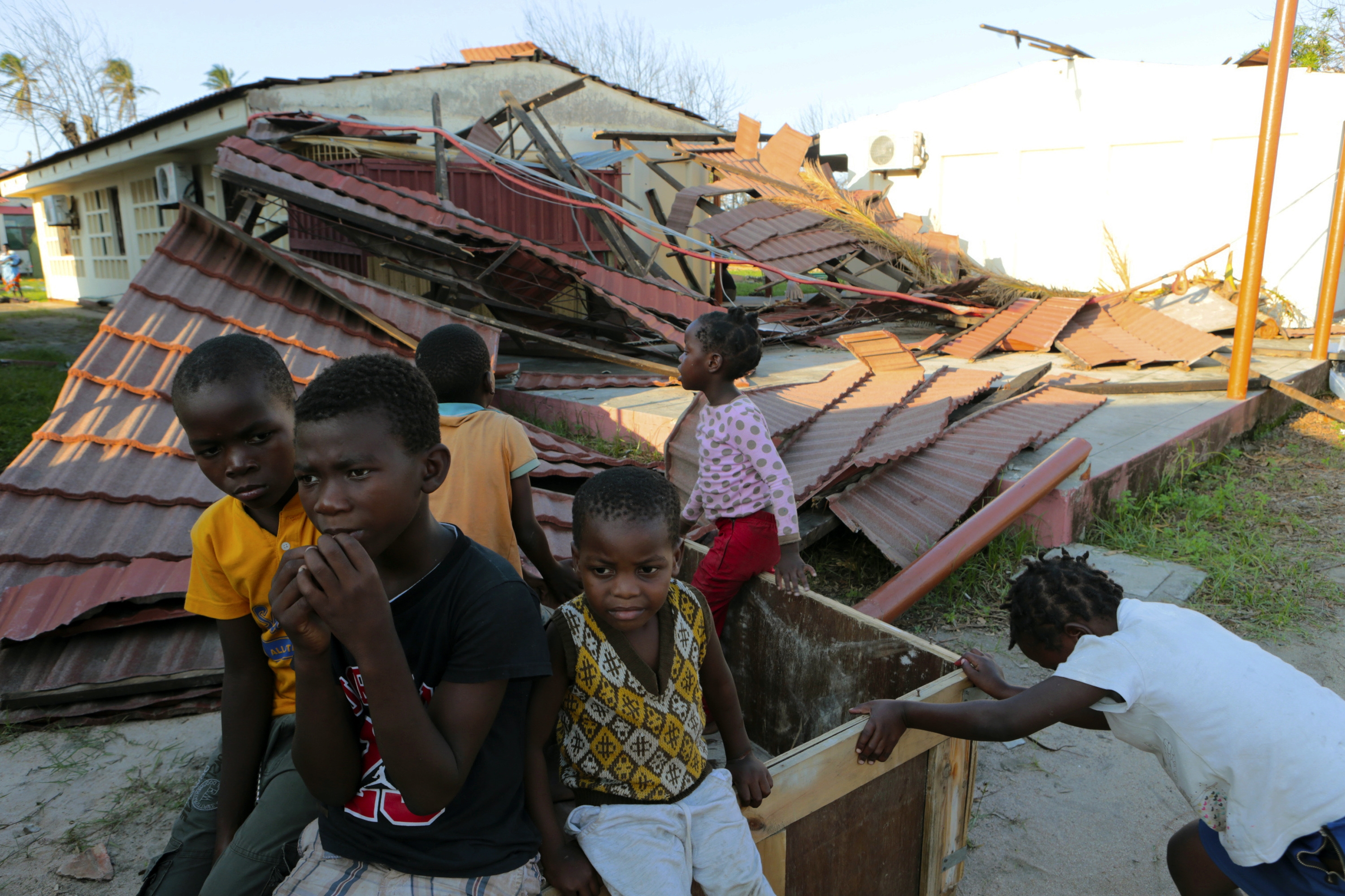 Children play within the grounds of a compound  set up for displaced people suspected to have cholera in  Beira,  Mozambique,Tuesday, March, 26, 2019.The United Nations is making an  emmergency appeal for $282 million  for the next  three months  to  help Mozambique start recovering  from the devastation of Cyclone Idau .(AP Photo/Tsvangirayi Mukwazhi)