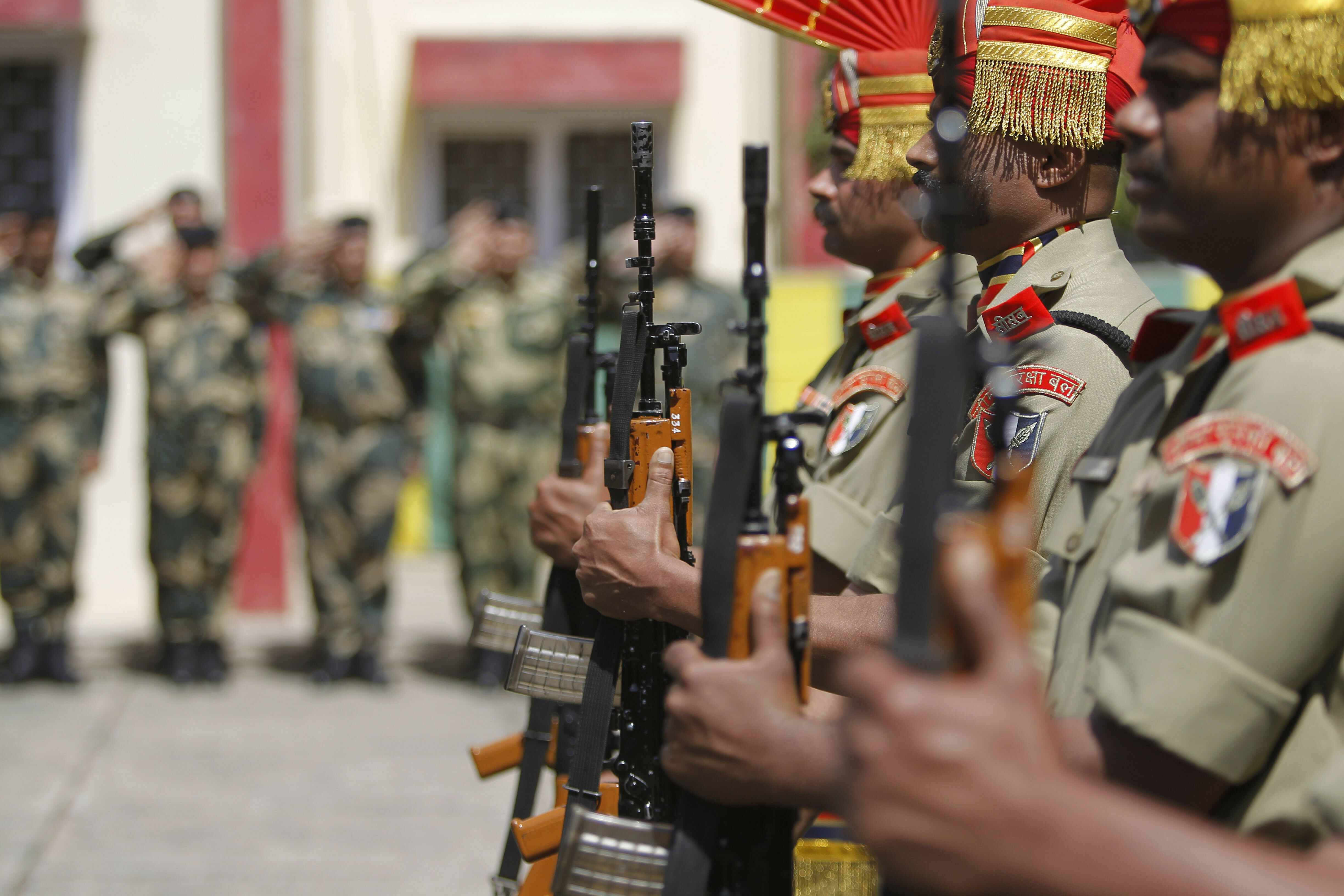 Indian Border Security Force (BSF) soldiers pay tribute to to their killed colleague T. Alex Lalminlun during a wreath-laying ceremony at the BSF headquarters in Jammu, India, Tuesday, April.2, 2019.  Pakistan and India traded fire in the disputed Himalayan region of Kashmir, leaving seven people dead — three Pakistani soldiers, a Pakistani villager, an Indian woman and a girl and a member of the Indian paramilitary troops, officials said Tuesday. (AP Photo/Channi Anand)