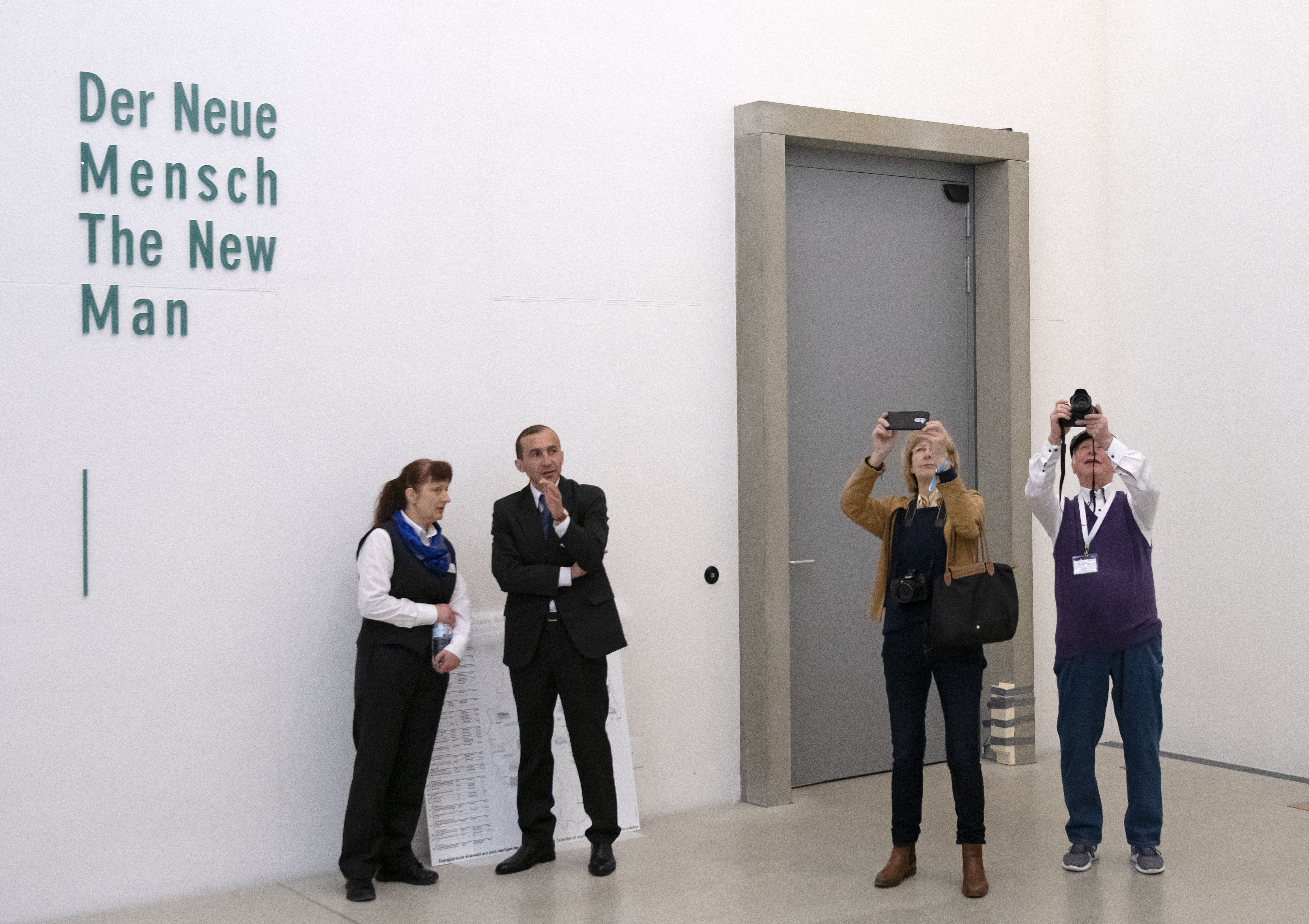 Visitors hold camera devices during the press preview prior to the opening of the new Bauhaus Museum of the 'Klassik Stiftung Weimar' (Classic Foundation Weimar) in Weimar, Germany, Thursday, April 4, 2019. The museum designed by Berlin-based architect Heike Hanada will focus on the early Bauhaus that was founded in Weimar in 1919 and stayed there until 1925. The official opening of the new Bauhaus Museums will take place on Friday, April 5, 2019. (AP Photo/Jens Meyer)