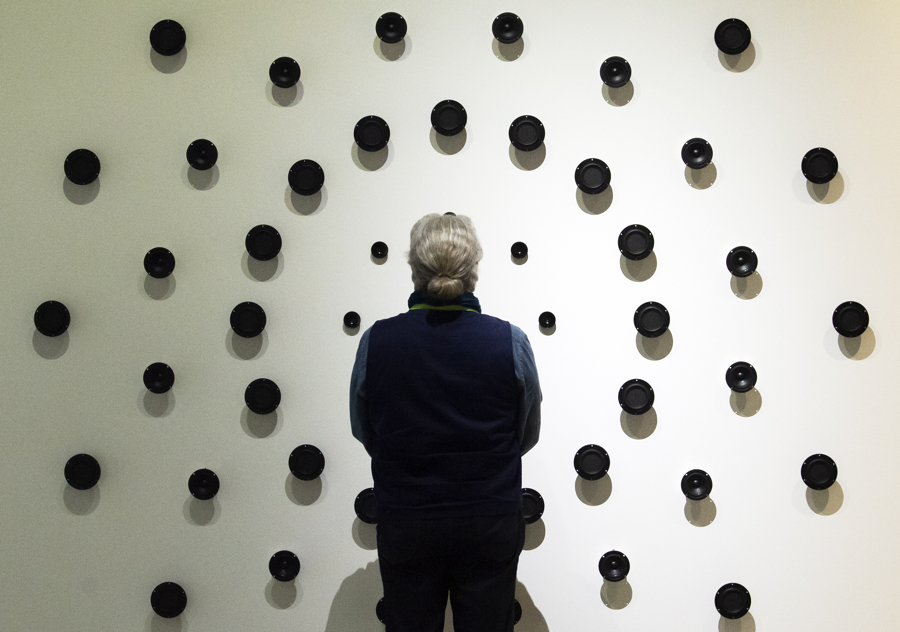 A vistor stands in front of a sound installation in one of the exhibition halls during the press preview prior to the opening of the new Bauhaus Museum of the 'Klassik Stiftung Weimar' (Classic Foundation Weimar) in Weimar, Germany, Thursday, April 4, 2019. The museum designed by Berlin-based architect Heike Hanada will focus on the early Bauhaus that was founded in Weimar in 1919 and stayed there until 1925. The official opening of the new Bauhaus Museums will take place on Friday, April 5, 2019. (AP Photo/Jens Meyer)