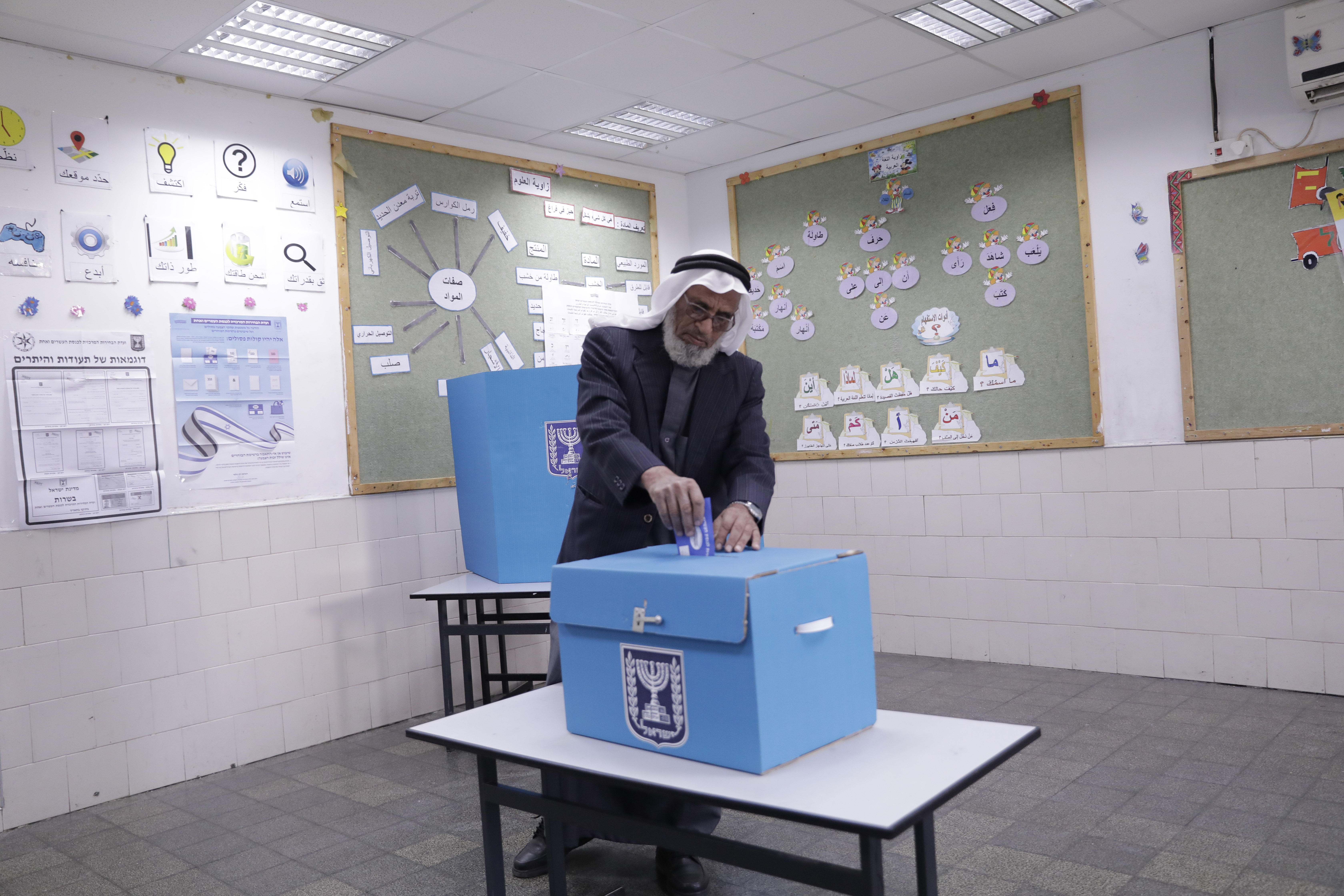 Israeli Bedouin votes during general elections in the city of Rahat, Tuesday, April 9, 2019. (AP Photo/Tsafrir Abayov)