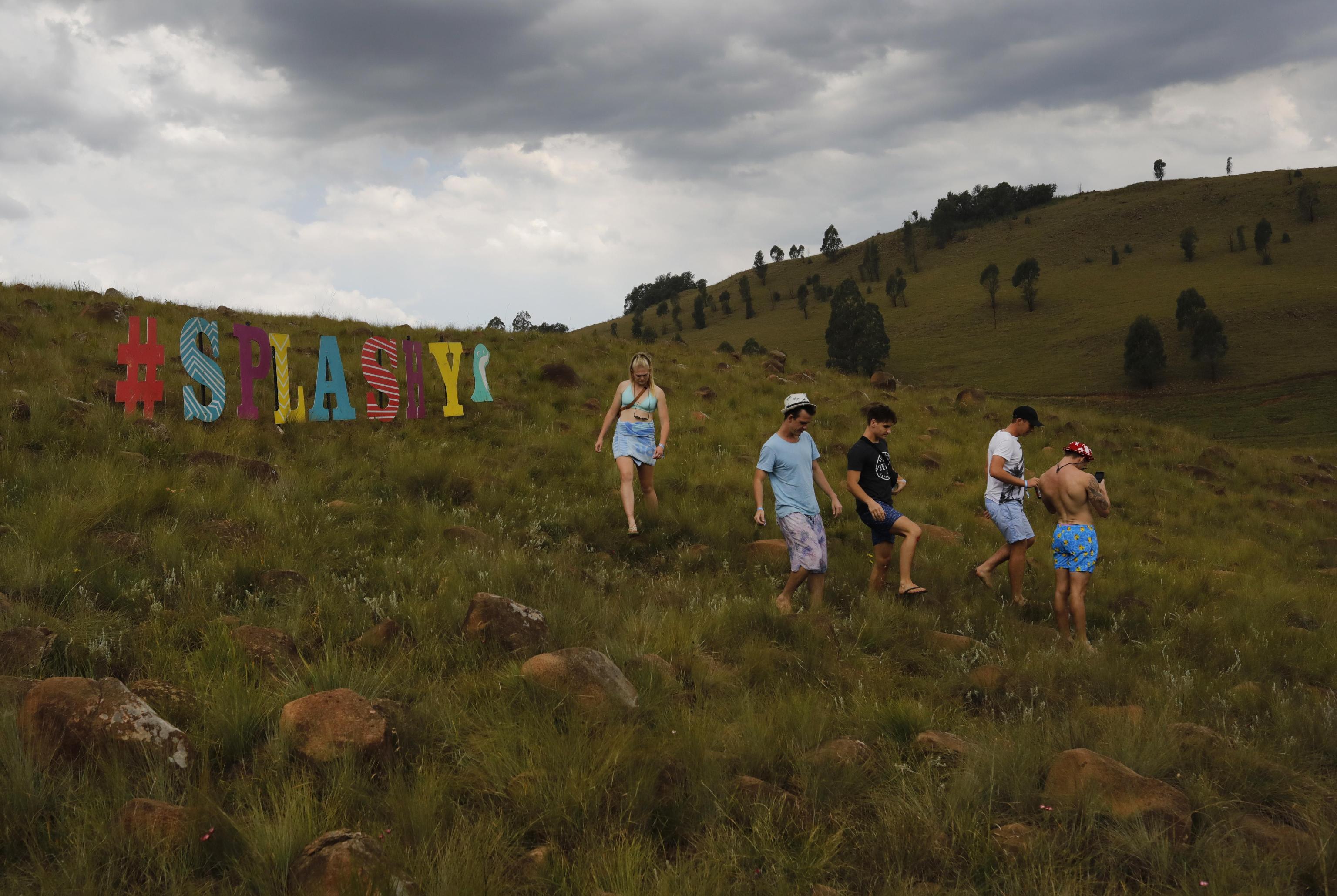 epa07514451 Festival goers during the annual Splashy Fen music festival in Underberg, South Africa, 18 April 2019. The five day long festival is the oldest in the country and is celebrating its 30 year. The festival has four stages with various music styles, morning yoga sessions, artworks, trail running, holistic lifestyle events, stalls etc.  EPA/KIM LUDBROOK