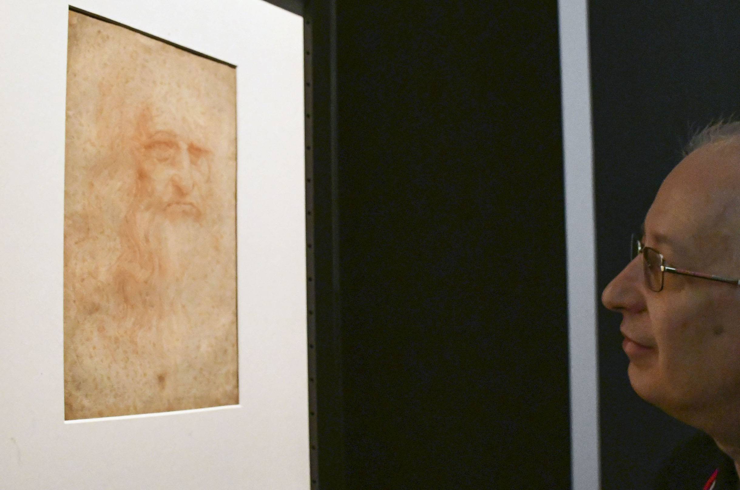 A man looks at a self-portrait of Leonardo da Vinci at a museum in Turin, Italy, on April 30, 2019. The museum is holding an exhibition through July of da Vinci's drawings and notebooks to mark the 500th anniversary of his death. (Kyodo via AP Images) ==Kyodo
