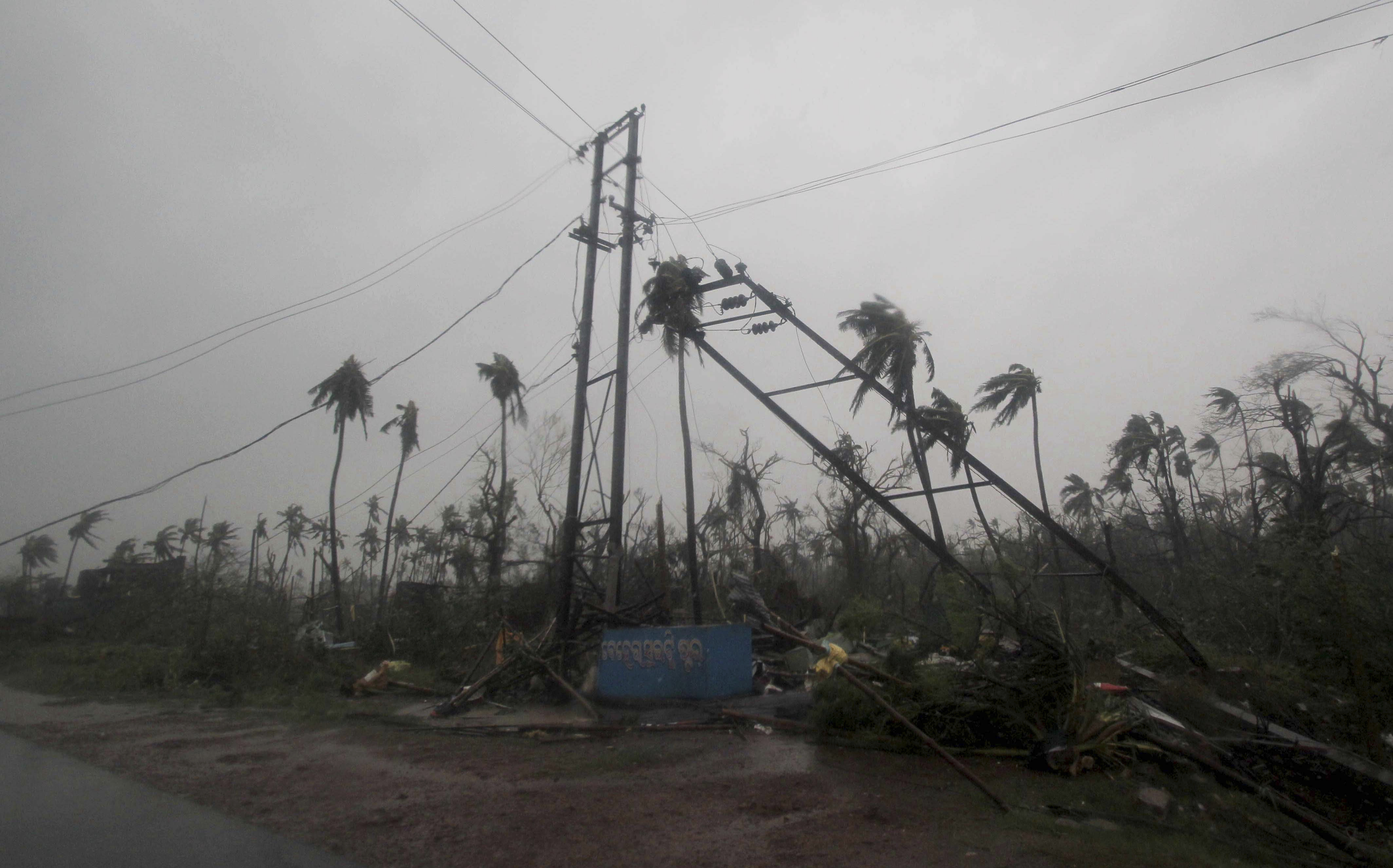 Uprooted tress and damaged electric poles are seen along a road in Puri district after Cyclone Fani hit the coastal eastern state of Odisha, India, Friday, May 3, 2019. Cyclone Fani tore through India's eastern coast on Friday as a grade 5 storm, lashing beaches with rain and winds gusting up to 205 kilometers (127 miles) per hour and affecting weather as far away as Mount Everest as it approached the former imperial capital of Kolkata. (AP Photo)