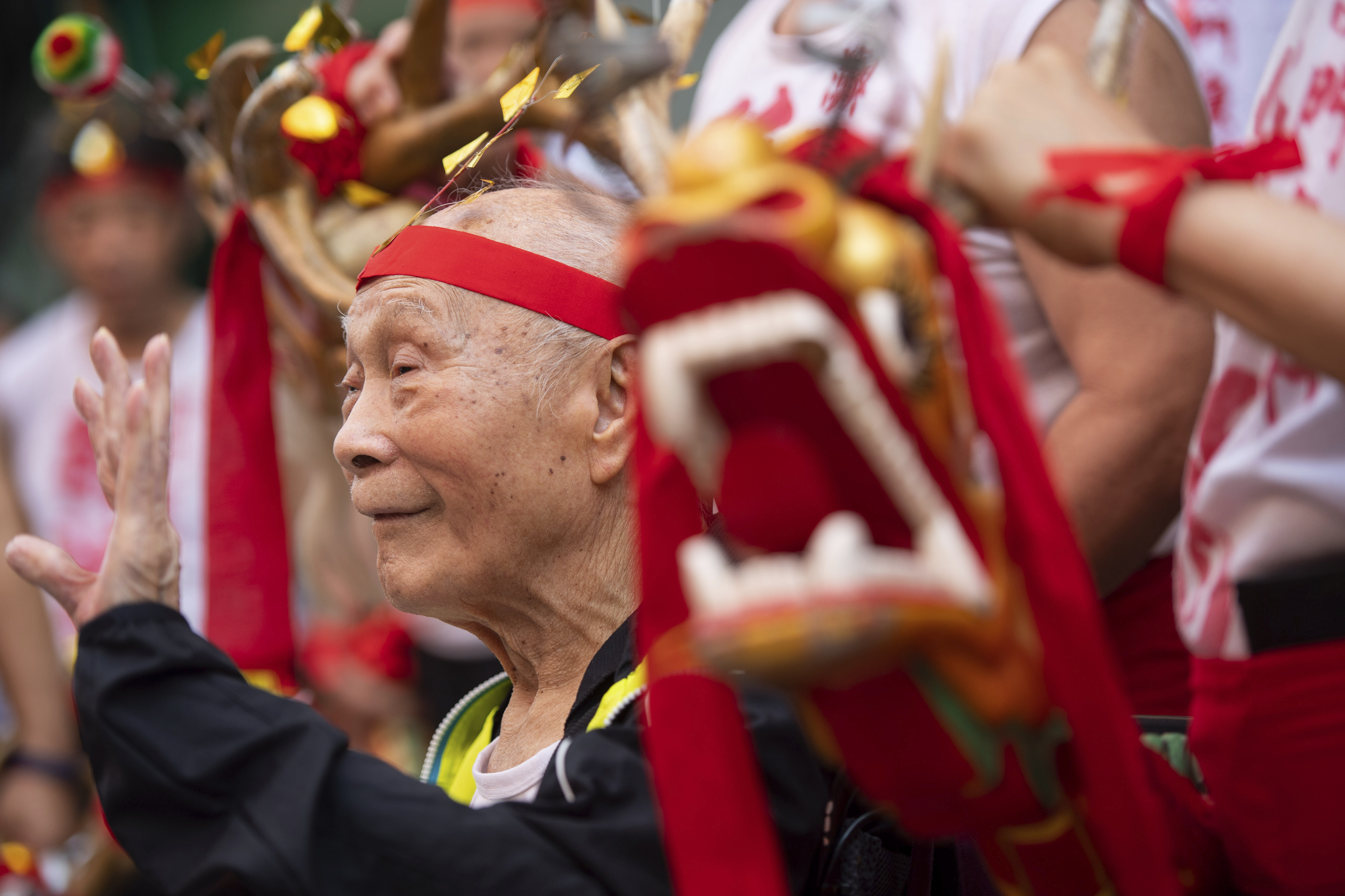 People perform drunk dragon dance during the Drunken Dragon Festival to celebrate the Buddha's birthday in Macau, China, 12 May 2019. Recognized as an item of China's national intangible cultural heritage, the Drunken Dragon Festival originates from a Macao legend of a Buddhist monk and a divine dragon who saved people from the plague during the Qing Dynasty.  (Imaginechina via AP Images)