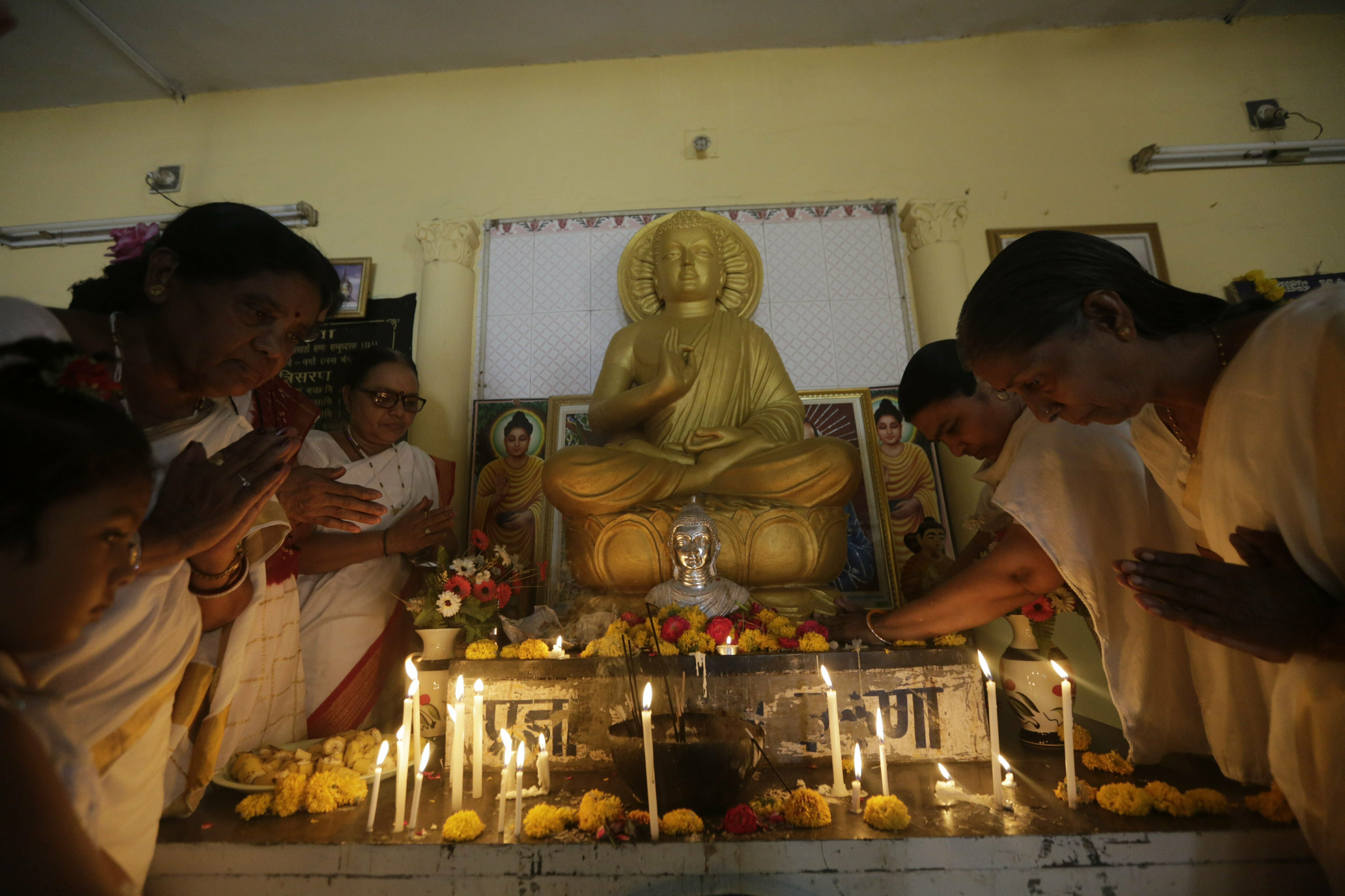 Indians offer prayers on Buddha Purnima festival in Ahmadabad, India, Saturday, May 18, 2019. The festival marks the birth, enlightenment and death of Buddha. (AP Photo/Ajit Solanki)
