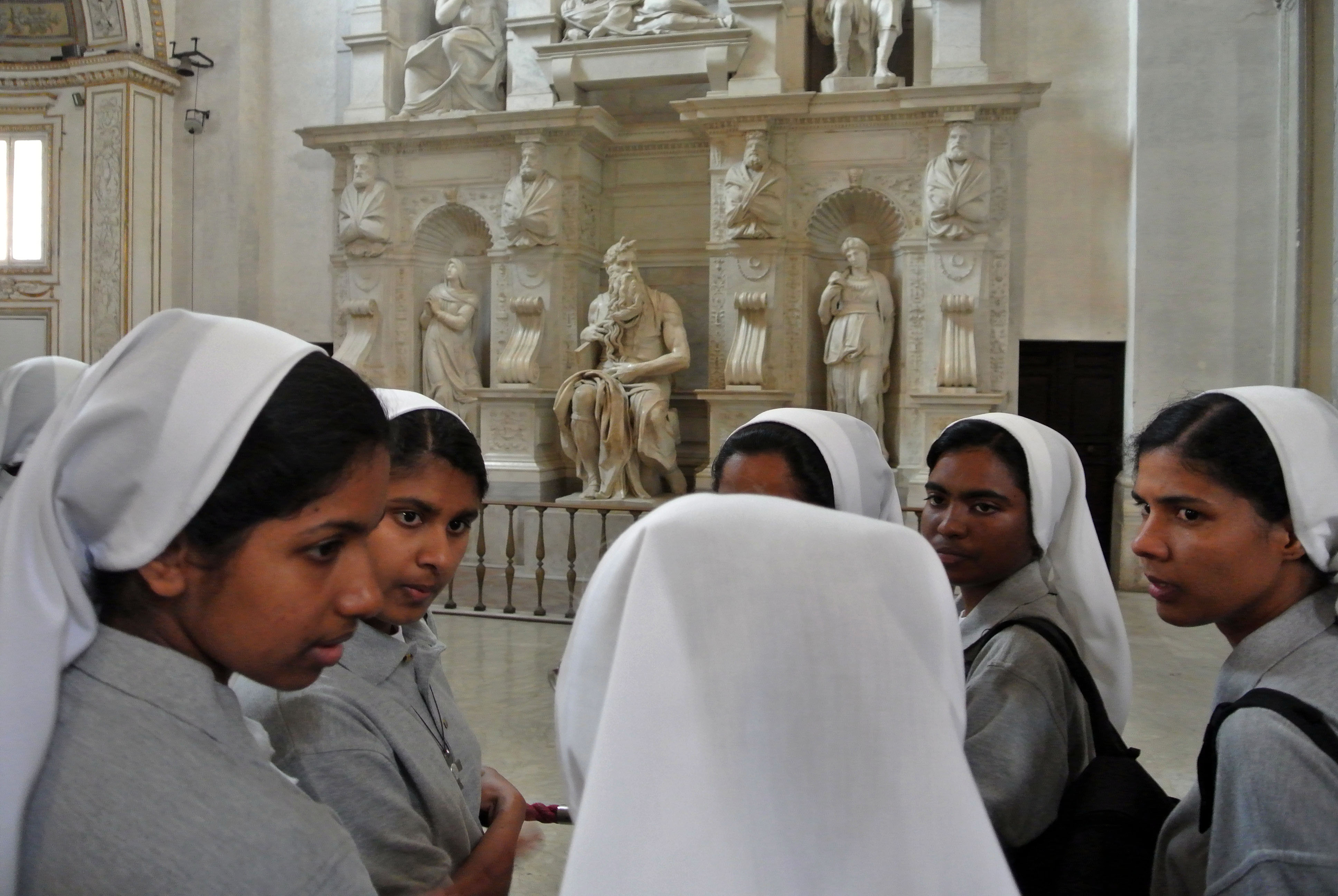 Nuns admire Michelangelo's Moses masterpiece inside St. Peter's in chains Basilica, in Rome, Tuesday, July 2, 2013. The Moses is part of Pope Julius II's tomb, a project Michelangelo worked on intermittently for 40 years, between 1505 and 1545. (AP Photo/Gregorio Borgia)