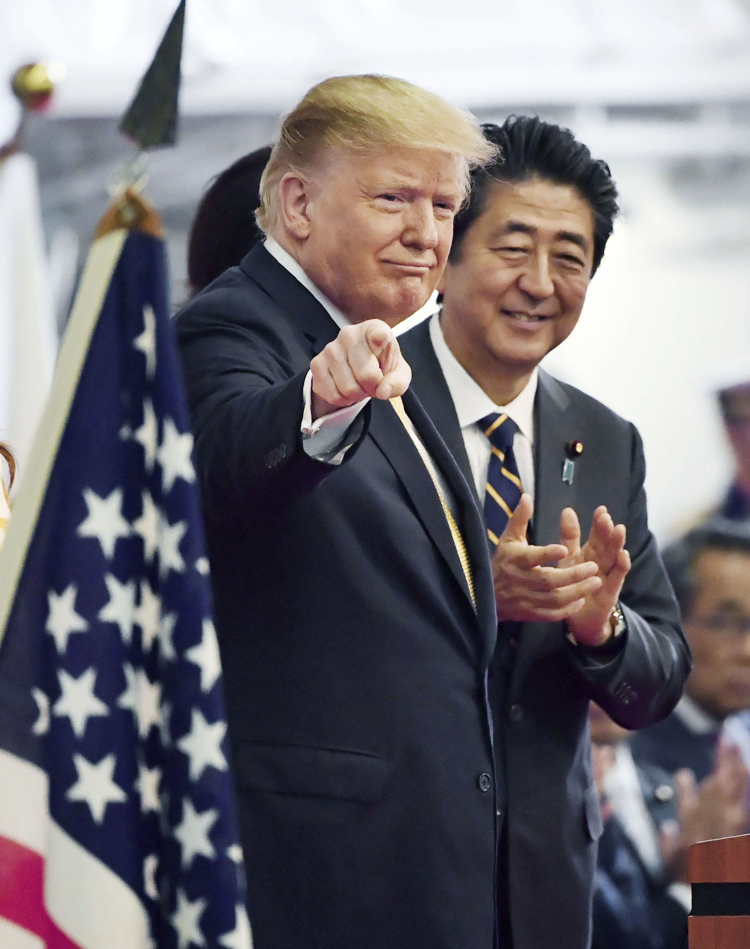 U.S. President Donald Trump (L) and Japanese Prime Minister Shinzo Abe are pictured during their inspection of the Japanese Maritime Self-Defense Force's helicopter-carrying destroyer Kaga, docked at the MSDF's base in Yokosuka, south of Tokyo, on May 28, 2019. (Pool photo) (Kyodo via AP Images) ==Kyodo