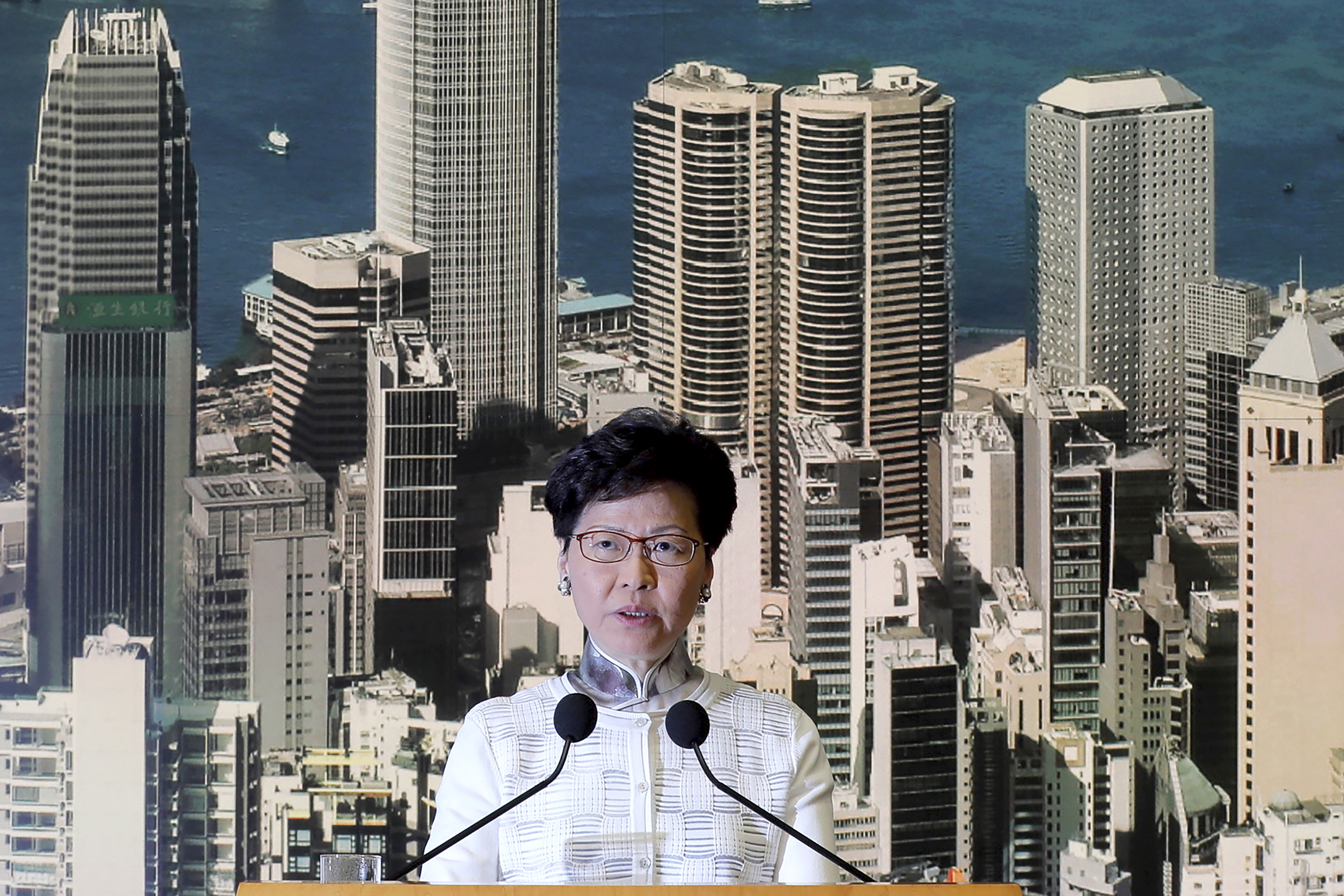 Hong Kong's Chief Executive Carrie Lam arrives holds a press conference in Hong Kong on Saturday, June 15, 2019. Lam said she will suspend a proposed extradition bill indefinitely in response to widespread public unhappiness over the measure, which would enable authorities to send some suspects to stand trial in mainland courts. (AP Photo/Kin Cheung)