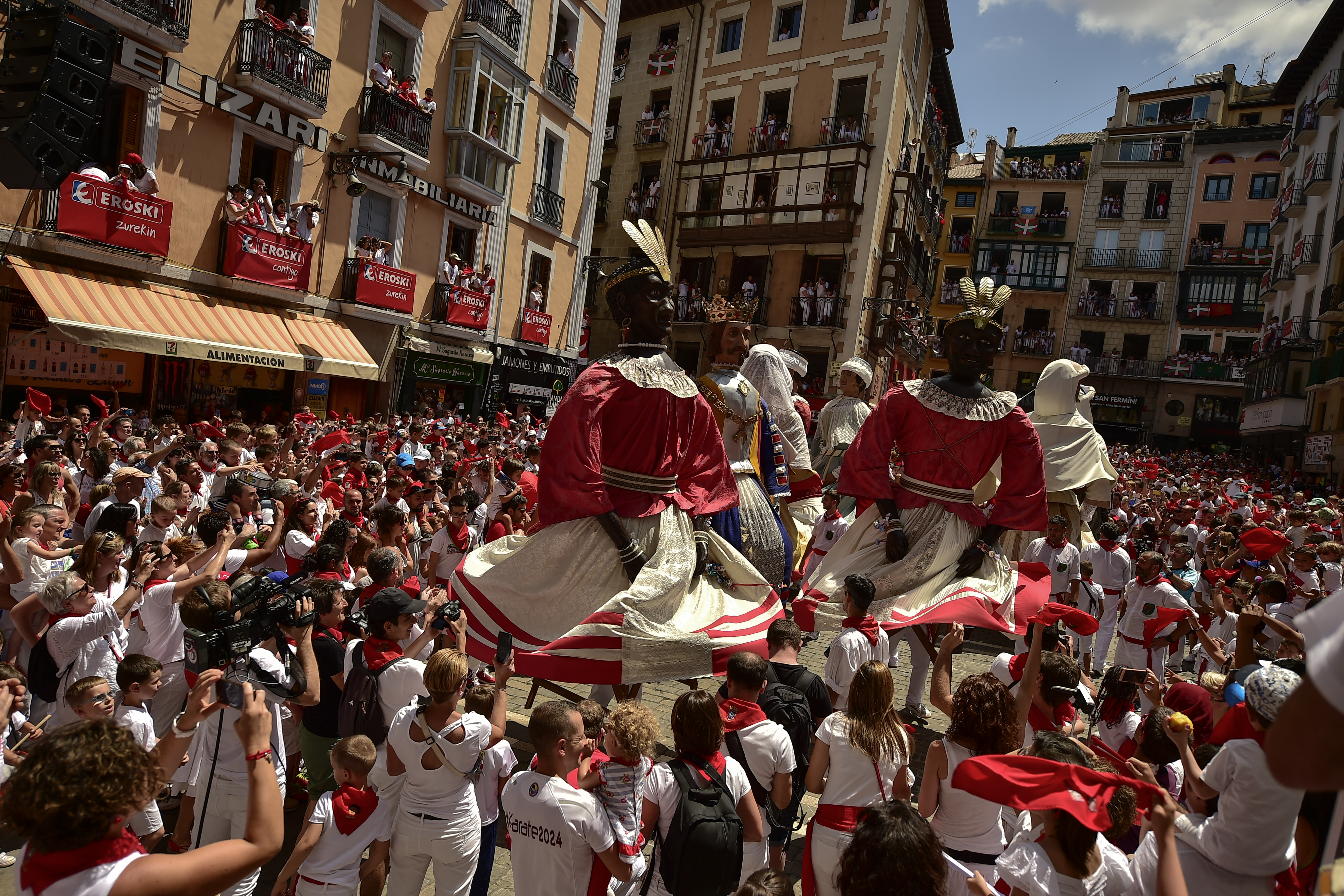 San Fermin's Comparsa Parade dance the last dance before saying good bye at the San Fermin Festival in Pamplona, northern Spain, Sunday July 14, 2018. Revellers from around the world flock to Pamplona every year to take part in the eight days of the running of the bulls. (AP Photo/Alvaro Barrientos)