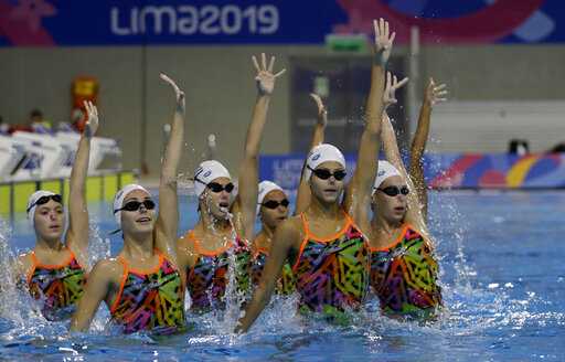 The synchronized swimming team of Cuba performs their routine during a training session at the Pan Am Games in Lima, Peru, Thursday, July 25, 2019. (AP Photo/Fernando Vergara)