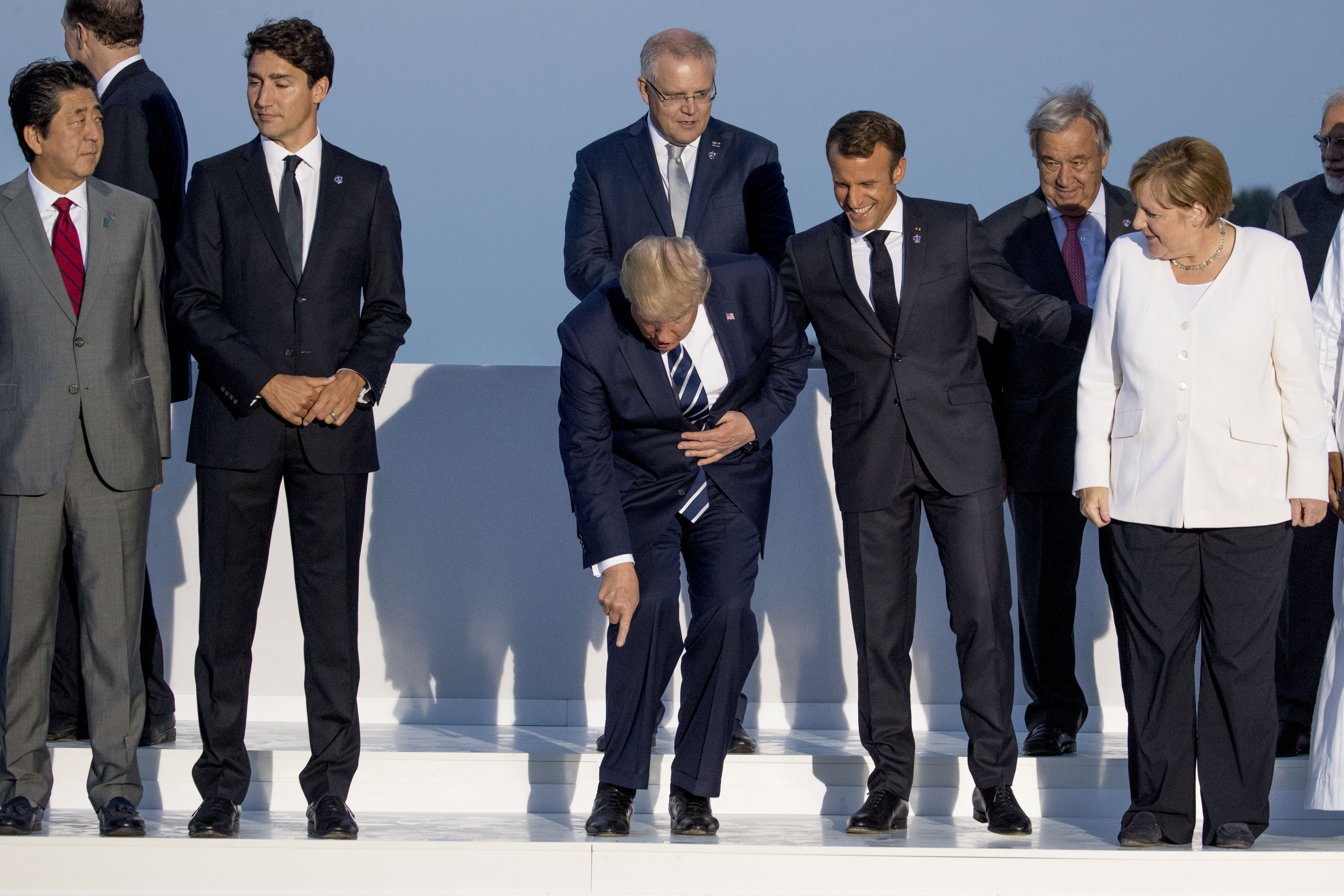 From left:  Japanese Prime Minister Shinzo Abe, Canadian Prime Minister Justin Trudeau, President Donald Trump, French President Emmanuel Macron, German Chancellor Angela Merkel, and others arrive for the G-7 family photo with guests at the G-7 summit at the Hotel du Palais in Biarritz, France, Sunday, Aug. 25, 2019. Also pictured is Indian Prime Minister Narendra Modi, right. (AP Photo/Andrew Harnik)