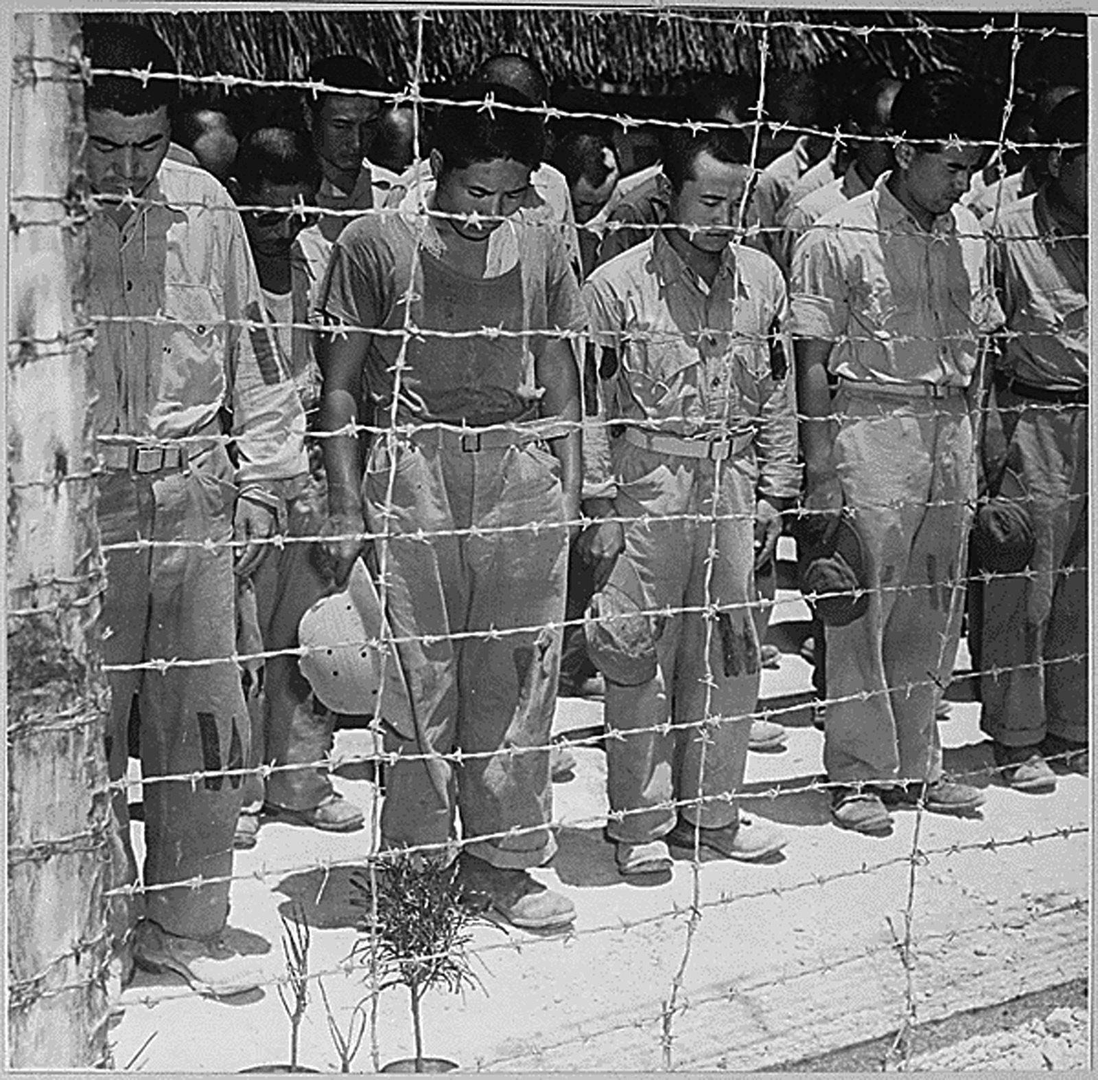 epa04867685 A handout image made available by the US National Archives and Records Administration (NARA) of Japanese Prisoners of War with bowed heads after hearing Emperor Hirohito making the announcement of Japan's unconditional surrender, at a POW center in Guam, 15 August 1945. 06 August 2015 marks the 70th anniversary of the atomic bombing on Hiroshima. The US B-29 Superfortress bomber Enola Gay dropped an atomic bomb codenamed 'Little Boy' on Hiroshima on 06 August 1945, killing tens of thousands of people in seconds. By the end of the year, 140,000 people had died from the effects of the bomb. On 09 August 1945 a second atomic bomb was exploded over Nagasaki, killing more than 73,000 people. The 'Little Boy' was the first ever nuclear bomb dropped on a city and a crucial turn that led to Japan's surrender in WWII.  EPA/US NATIONAL ARCHIVES / HANDOUT  HANDOUT EDITORIAL USE ONLY