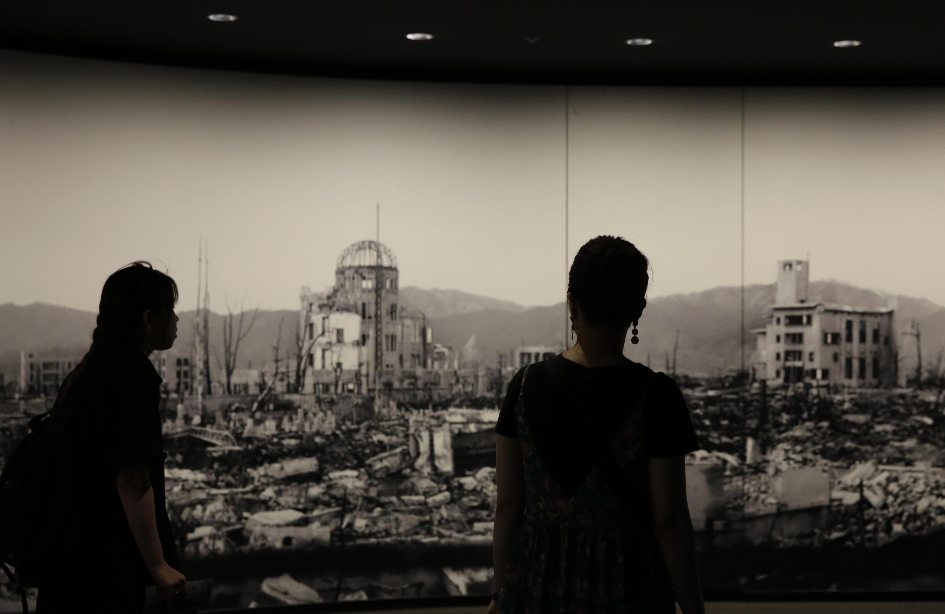 epa07839167 (FILE) - Visitors are watching a photo of the Atomic Bomb Dome and around the area devastated by the atomic bombing of Hiroshima in 1945 at Hiroshima Peace Memorial Museum  in Hiroshima, western Japan, 17 July 2019. The Vatican announced on 13 September 2019 Pope Francis will visit Japan from 23 to 26 November and the WWII atomic bombed cities of Hiroshima Nagasaki. The Pope's visit to Japan will be for the first time since John Paul II visited in 1981. Fuji died at the age of 42 in 1977.  EPA/KIMIMASA MAYAMA