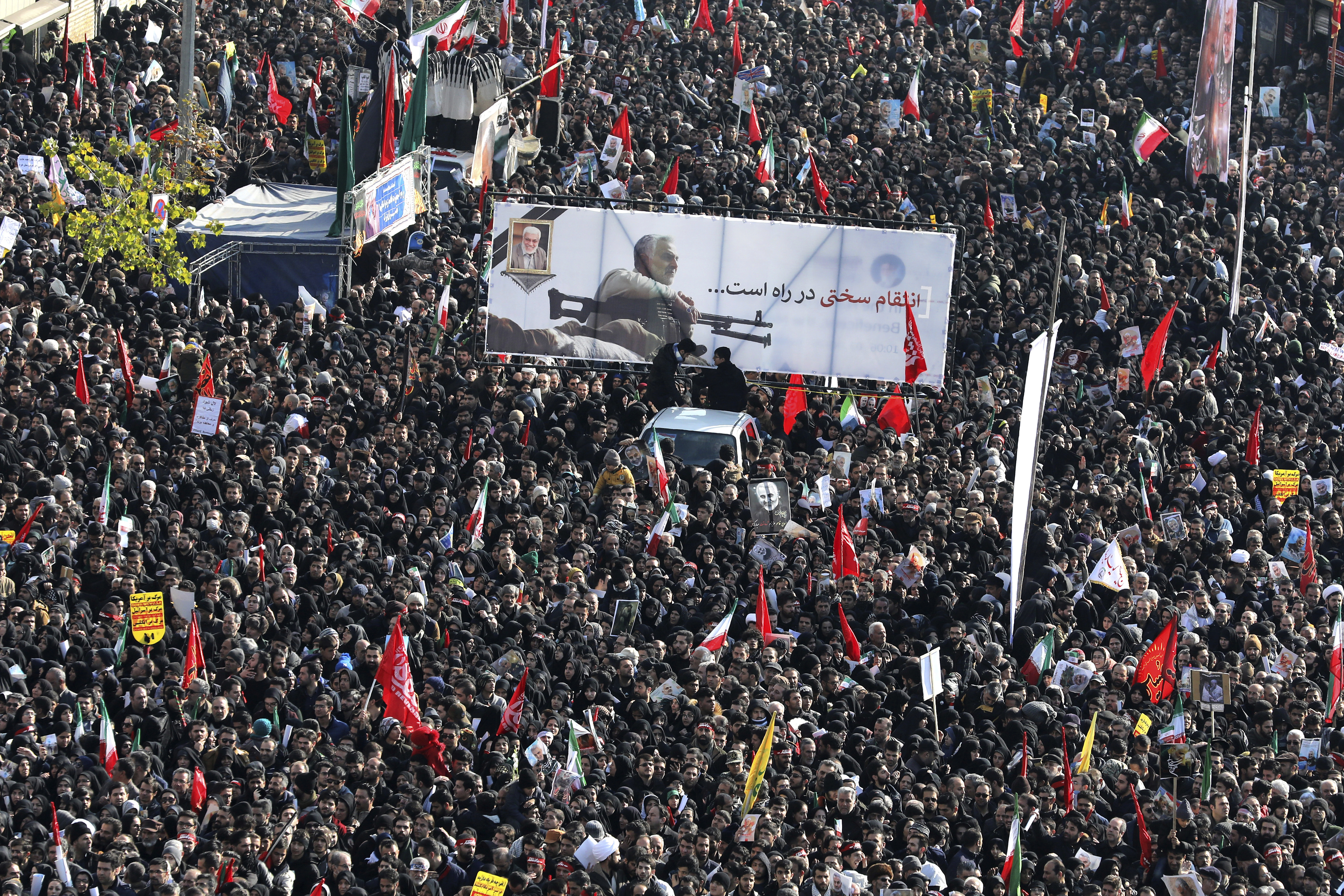 Mourners attend a funeral ceremony for Iranian Gen. Qassem Soleimani and his comrades, who were killed in Iraq in a U.S. drone strike on Friday, at the Enqelab-e-Eslami (Islamic Revolution) square in Tehran, Iran, Monday, Jan. 6, 2020. The processions mark the first time Iran honored a single man with a multi-city ceremony. Not even Ayatollah Ruhollah Khomeini, who founded the Islamic Republic, received such a processional with his death in 1989. Soleimani on Monday will lie in state at Tehran's famed Musalla mosque as the revolutionary leader did before him. (AP Photo/Ebrahim Noroozi)